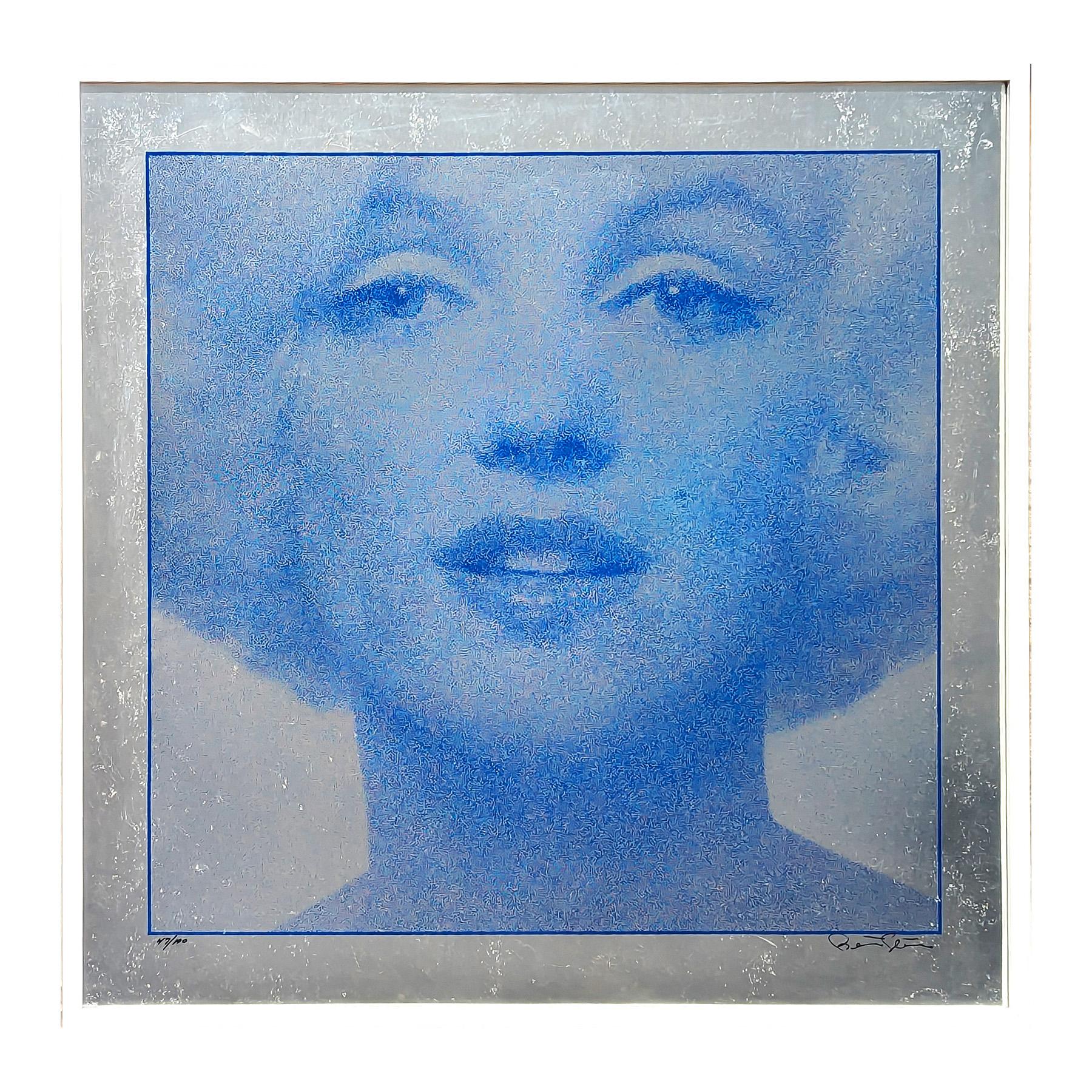 Blue-toned silkscreen portrait print of actress Marilyn Monroe by legendary photographer Bert Stern. The piece features a blue headshot portrait of Marilyn in blue on a metallic silver foil. 
Signed and editioned along the front lower margin.