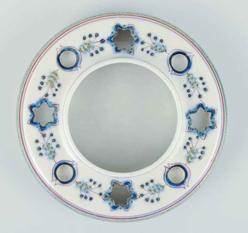 Berte Jessen for Aluminia. Advent wreath in faience. Hand-painted.
Model 556/3359.
Approximately from 1970.
Marked.
In excellent condition with natural cracks.
Dimensions: Diameter 16.0 cm x Height 3.2 cm.