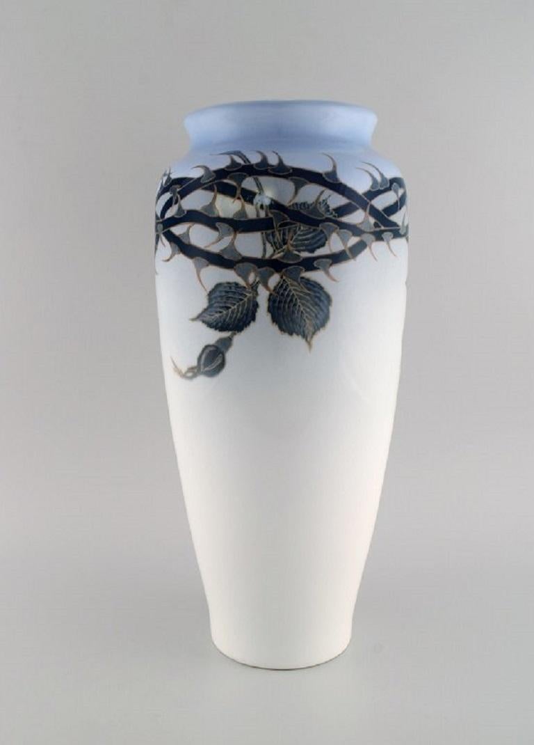 Bertha Nathanielsen for Royal Copenhagen. 
Large unique Art Nouveau vase in hand-painted porcelain. White rose with thorns. Dated 1929.
Measures: 44 x 21 cm.
In excellent condition.
Stamped.
1st factory quality.