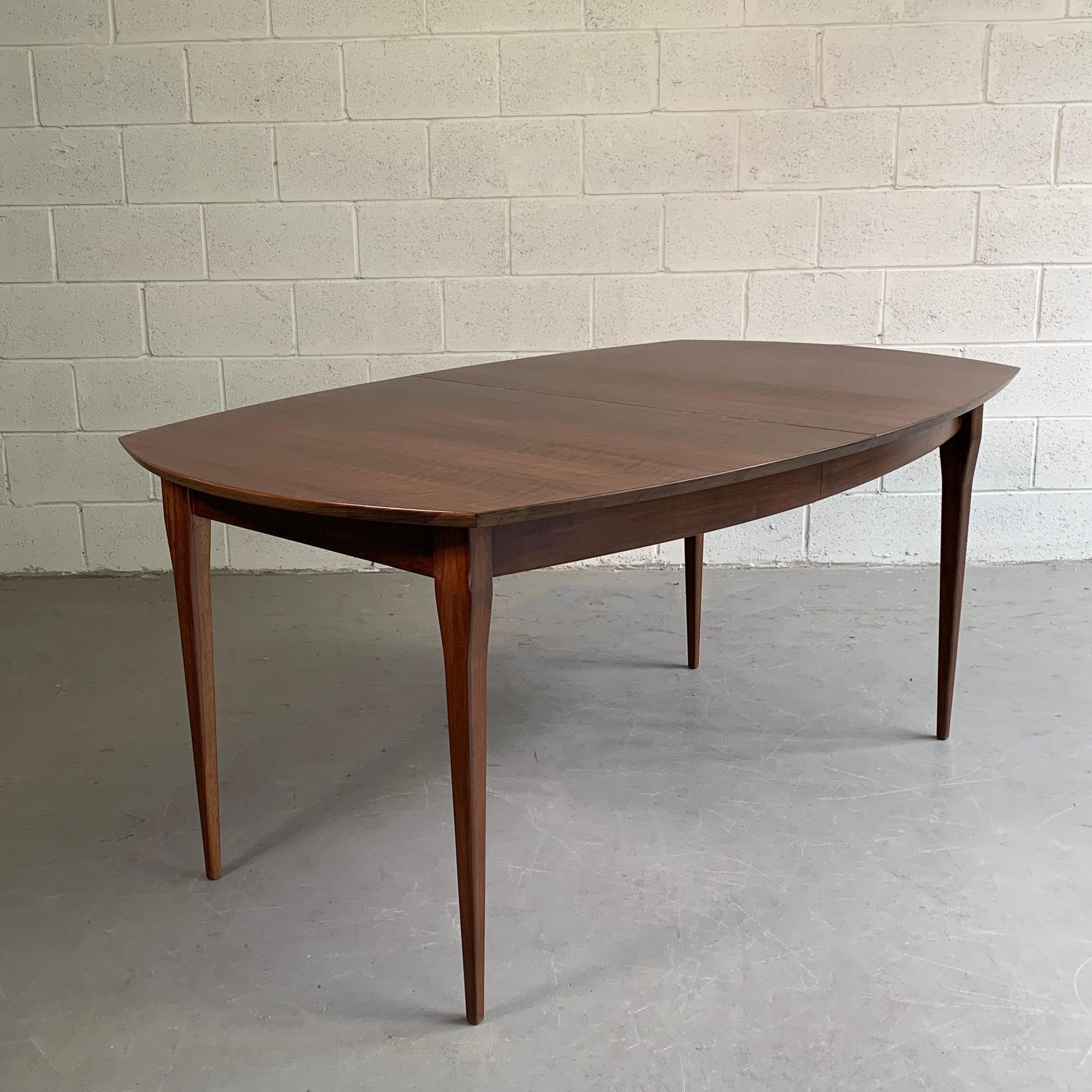 Beautifully detailed, Mid-Century Modern, walnut, extension dining table by Bertha Schaefer for M. Singer & Sons includes three, 16 inch leaves extending the table to 80 - 96 - 112 to accommodate up to 12 people.