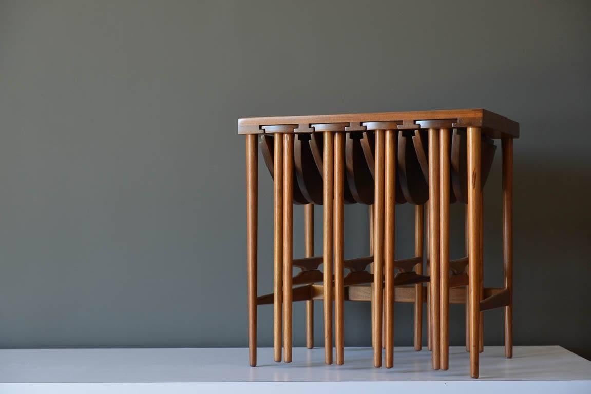 Bertha Schaefer for Singer and Sons Walnut Nesting Tables, ca. 1955.  Set of 4 round nesting tables and one larger table.  Compact design, tables can be stored in the larger table for space saving and use only when needed.  Beautiful craftsmanship