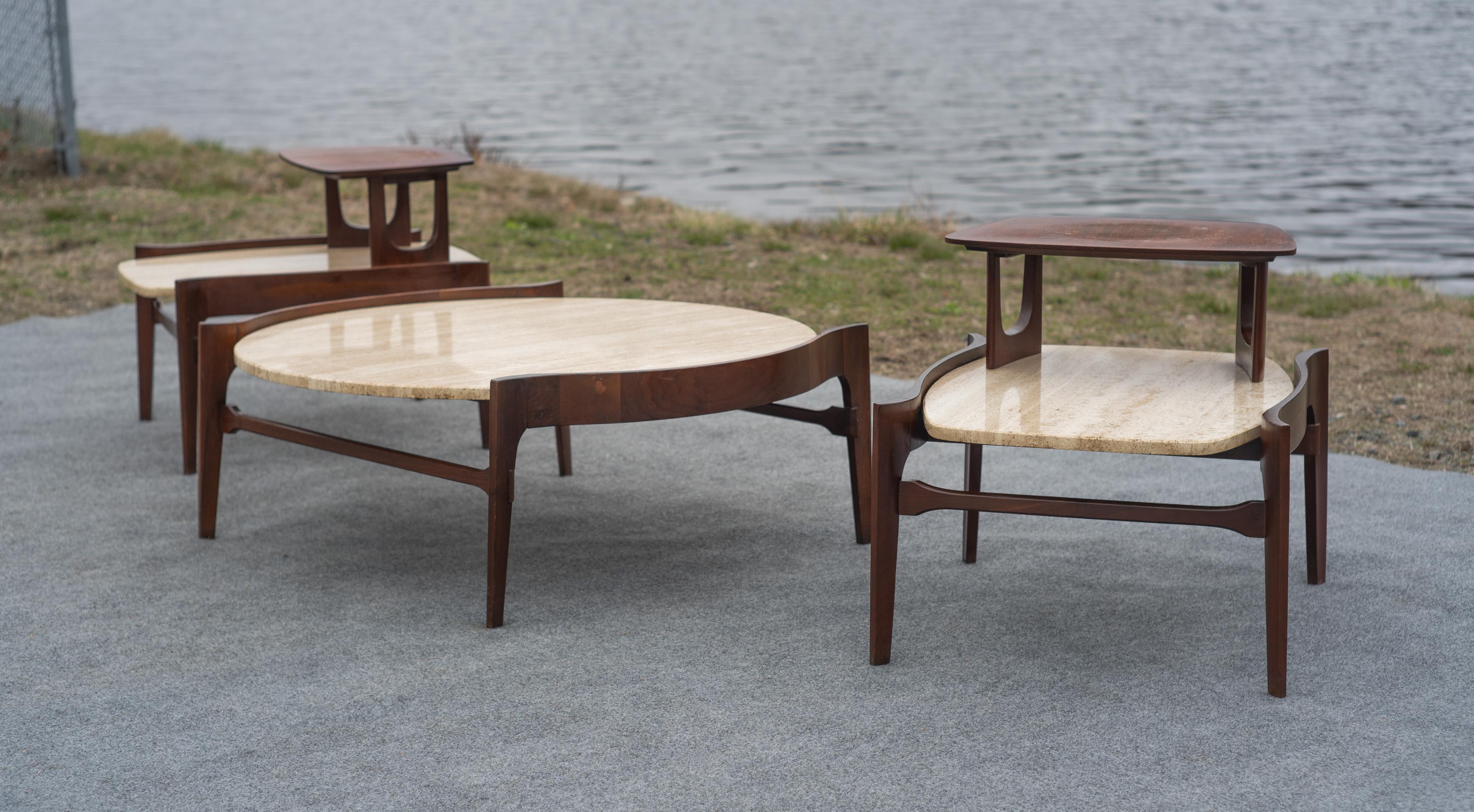 Designed by Bertha Schaefer, these tables were made by Singer & Sons, renowned for their cooperation with design and architecture icons like Gio Ponti and Ico Parisi. This table set features the most desirable models, the large round coffee table,