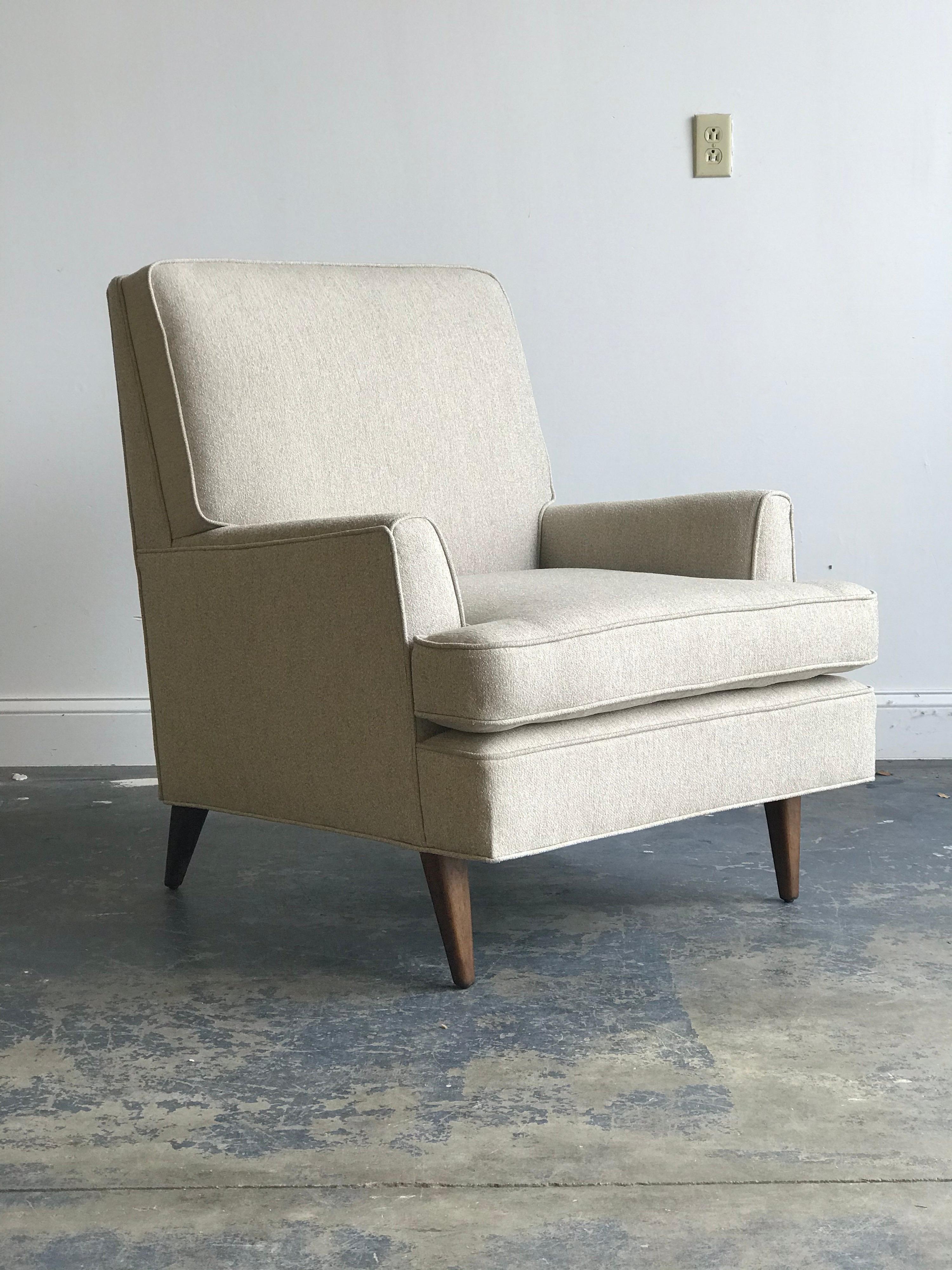 An elegant modernist armchair by Bertha Schaefer for M. Singer & Sons. Completely restored with a chenille type fabric, new foam, and refinished tapered solid mahogany legs. Chair was acquired with original upholstery, and as such, tags were