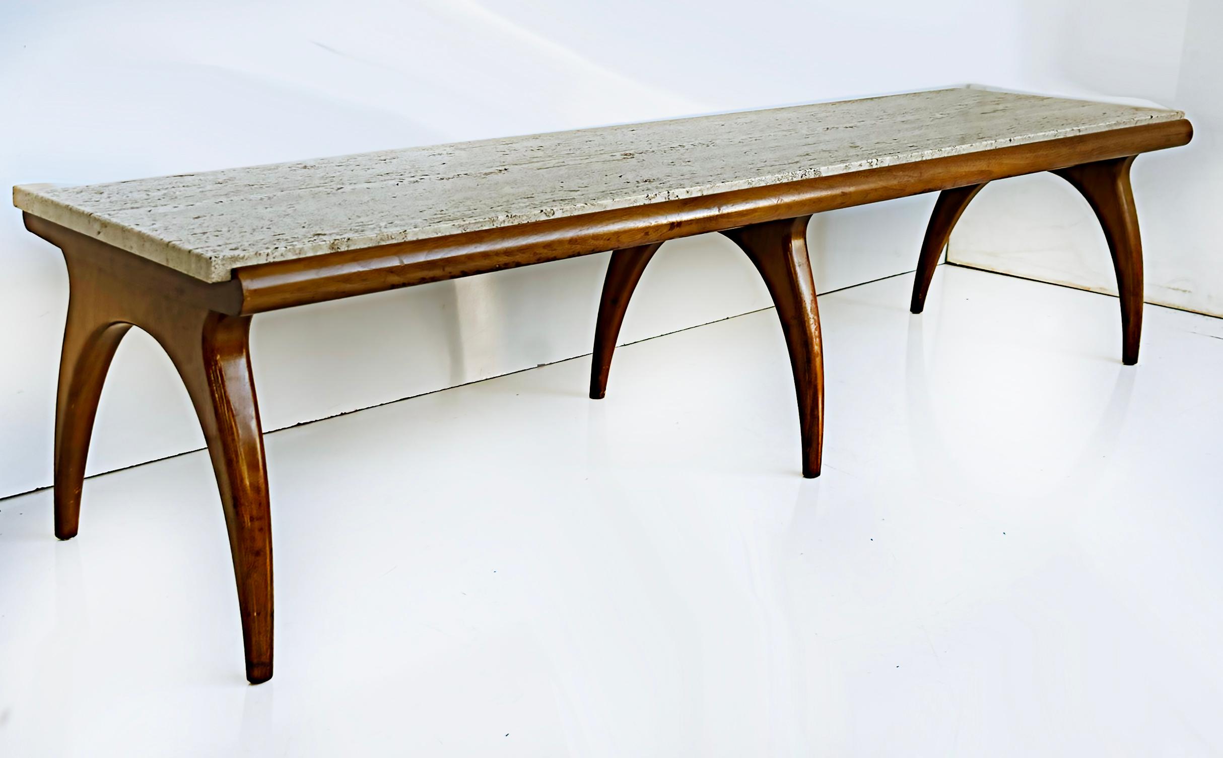 Bertha Schaefer M. Singer & Sons Walnut Travertine Coffee Table, 1960s

Offered for sale is a 1960s Mid-century Modern Bertha Schaefer coffee table by Singer & Sons, USA. The table has a walnut base with six sculptural curved supports and retains