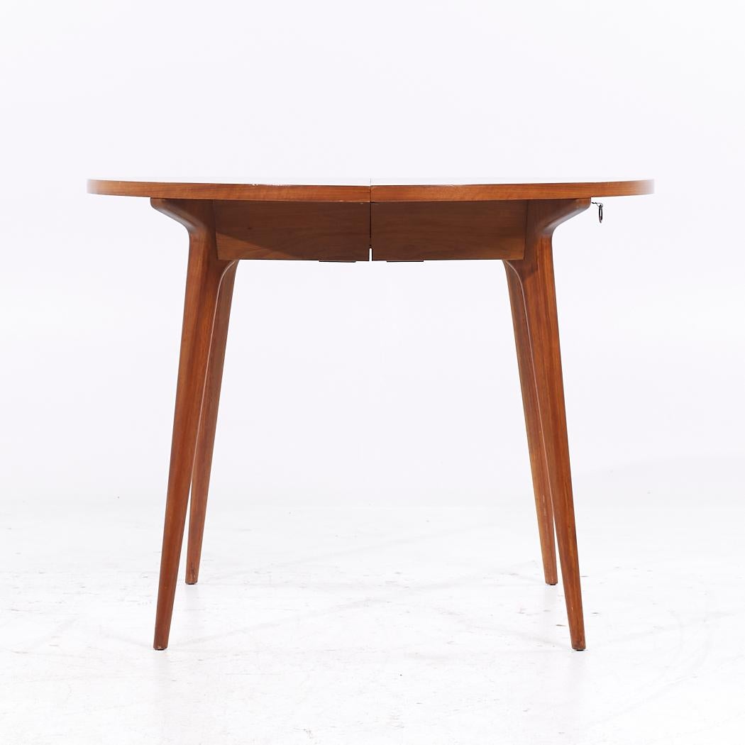 Bertha Schaefer Mid Century Table with 4 Leaves

This table measures: 38 wide x 38 deep x 29.25 inches high, with a chair clearance of 28 inches, each leaf measures 16.25 inches wide, making a maximum table width of 103 inches when all leaves are