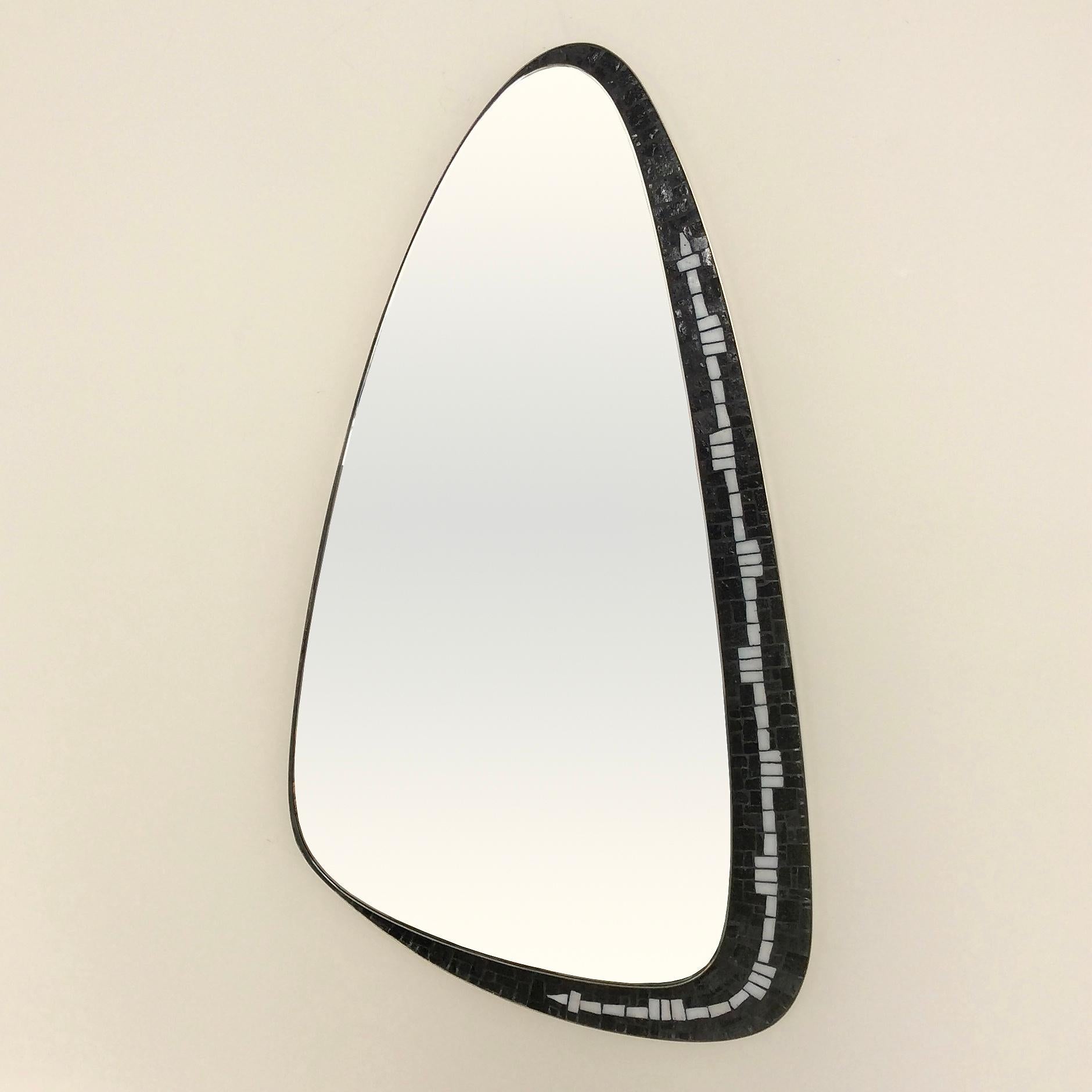 Rare Berthold Müller asymetrical wall mirror, circa 1950, Germany.
Brass frame, black and white glass mosaïc.
Dimensions: 89 cm H, 48 cm W, 2 cm D.
Original good condition.
All purchases are covered by our Buyer Protection Guarantee.
This item can