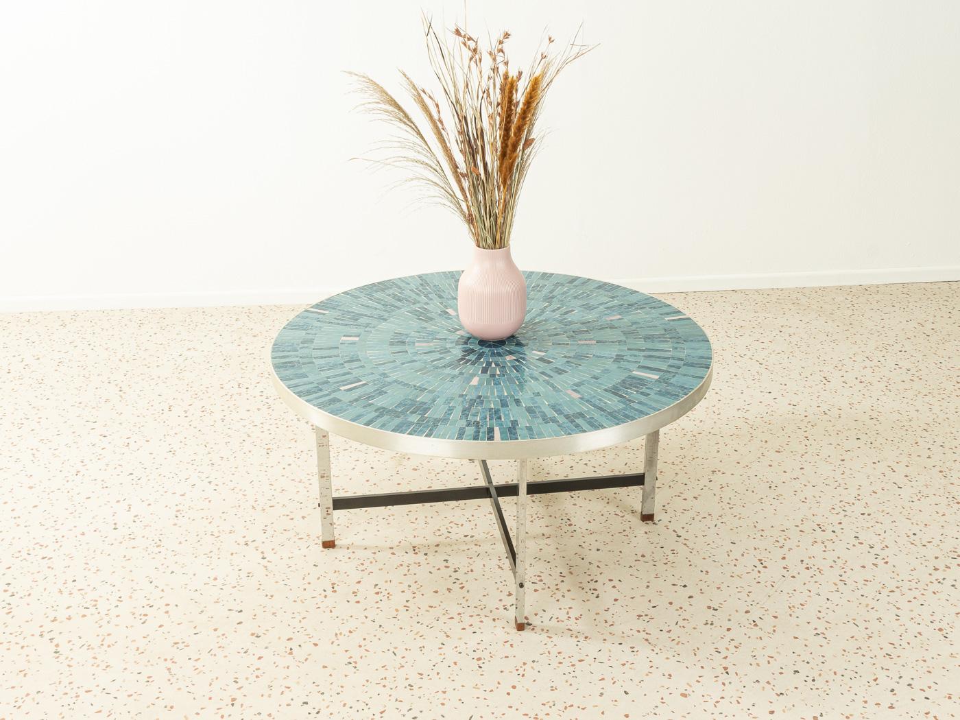 Unique coffee table from the 1960s. High quality table top with steel border, a mosaic in blue, turquoise and grey and chrome legs.

Quality features:
- Very good workmanship
- High-quality materials
- Made in Germany, Designer: Berthold Müller