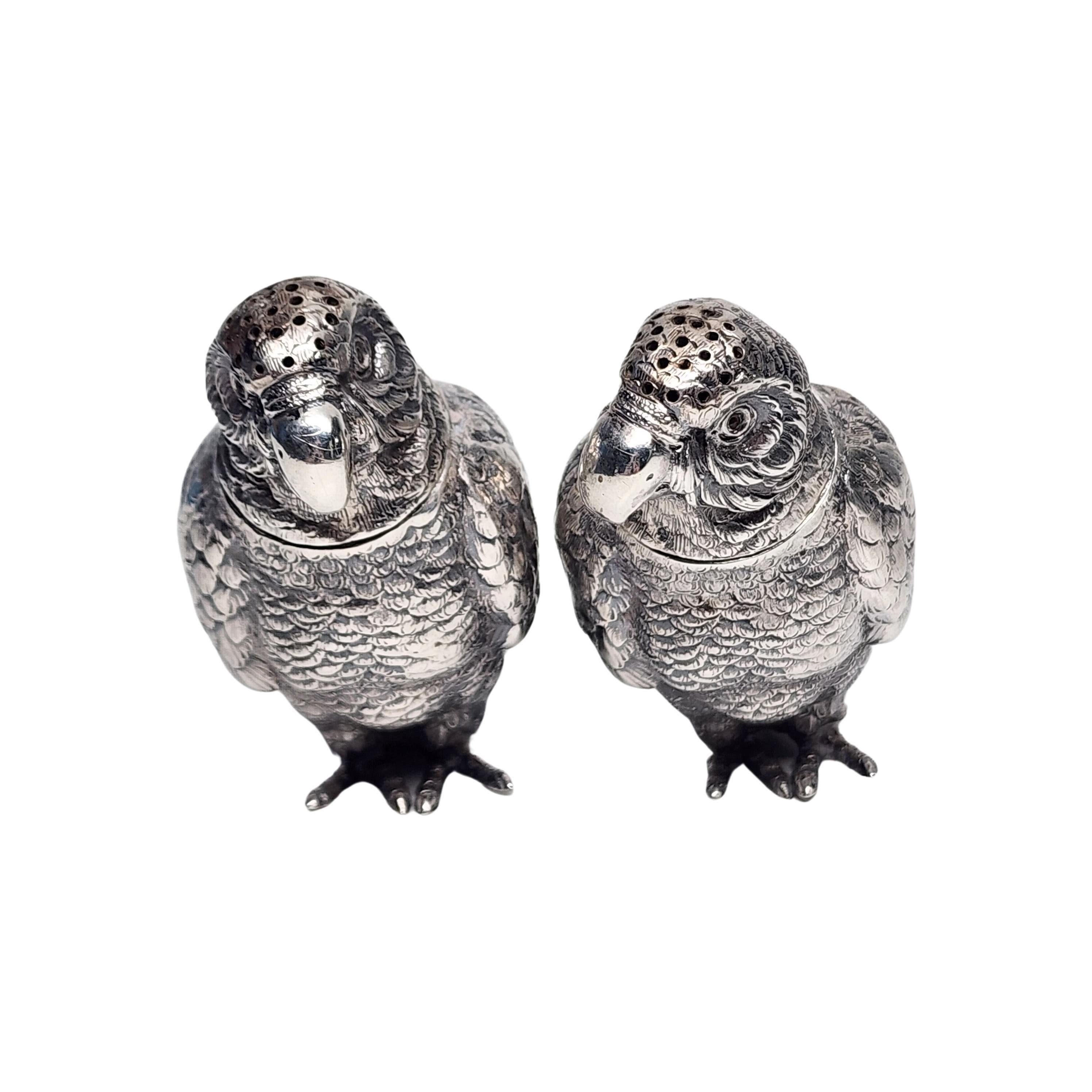 Vintage 935 sterling silver parrot salt and pepper shakers by Berthold Muller.

A pair of highly detailed parrot salt and pepper shakers by the renowned Berthold Muller. Each head twists off to fill, with notch and tab closures.

Measures approx 2