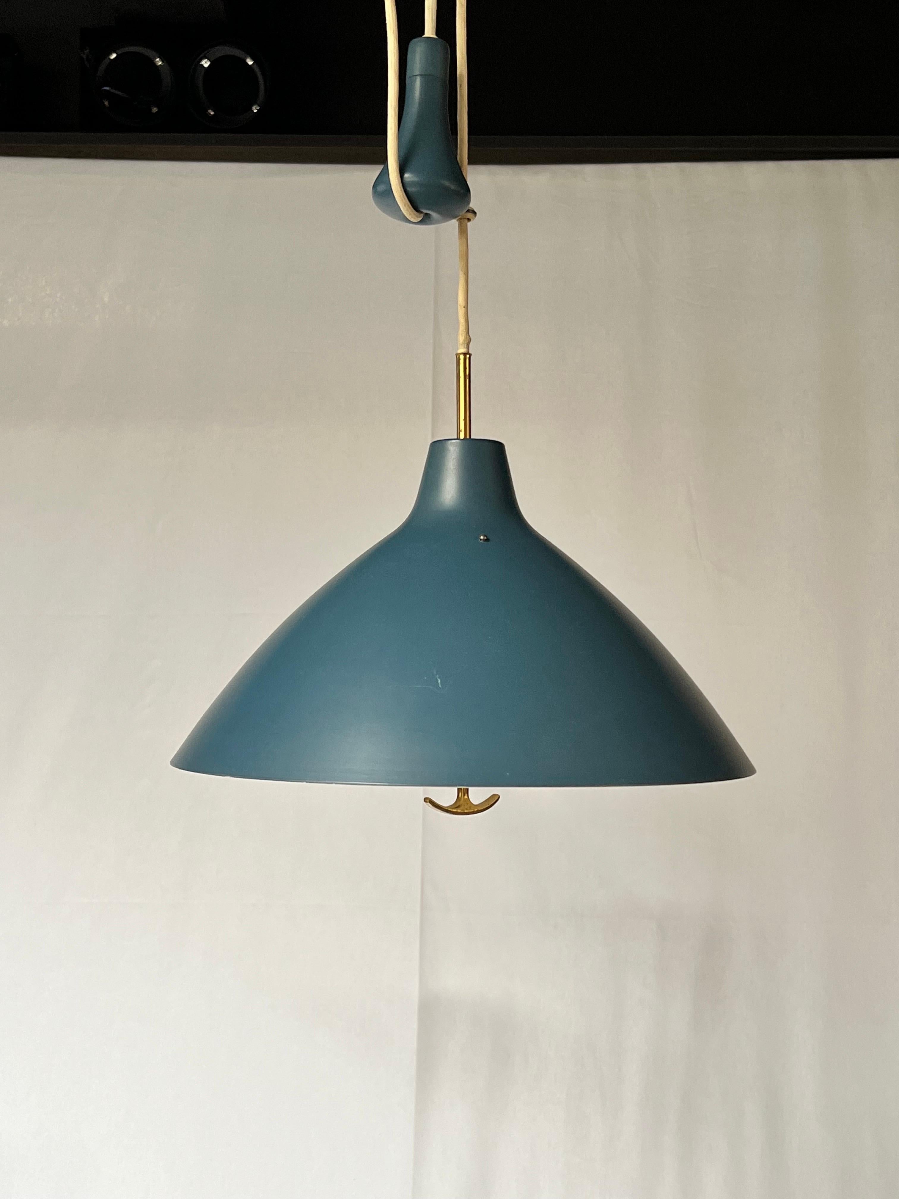 This is a typical blue Swedish used in the 1950's. Lamp made by Bertil Brisborg for ASEA. There is a counterweight to adjust the height. It's a very convenient lamp and well made. A brass handle is to be used to adjust the height. An acrylic dome