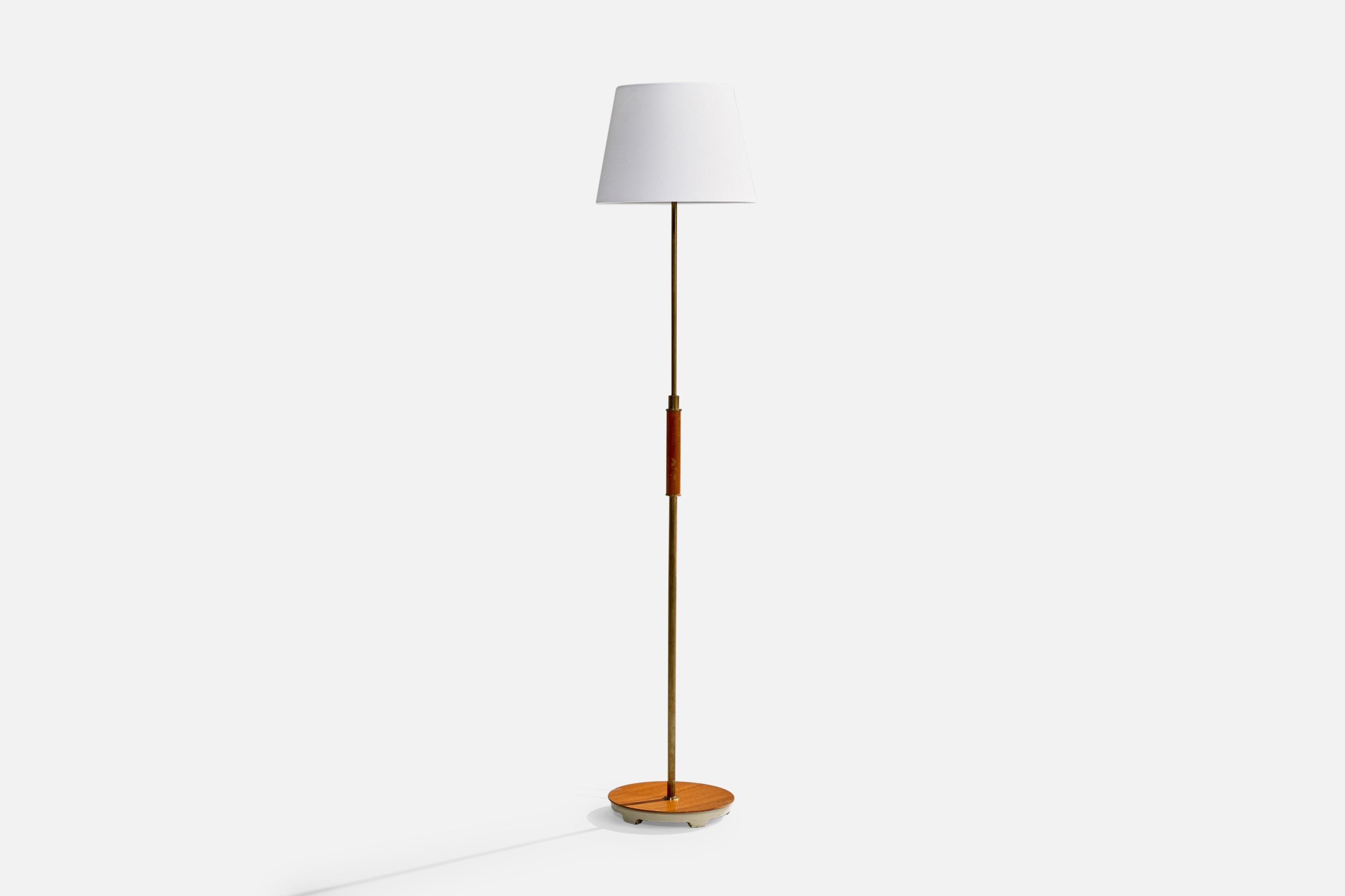 An adjustable brass, wood and iron and fabric floor lamp designed by Bertil Brisborg and produced by Nordiska Kompaniet, Sweden, 1940s.

Dimensions of Lamp with Shade (inches): 63.25“ H x 14“ Diameter

Bulb Specifications: E-26 Bulb

Number of