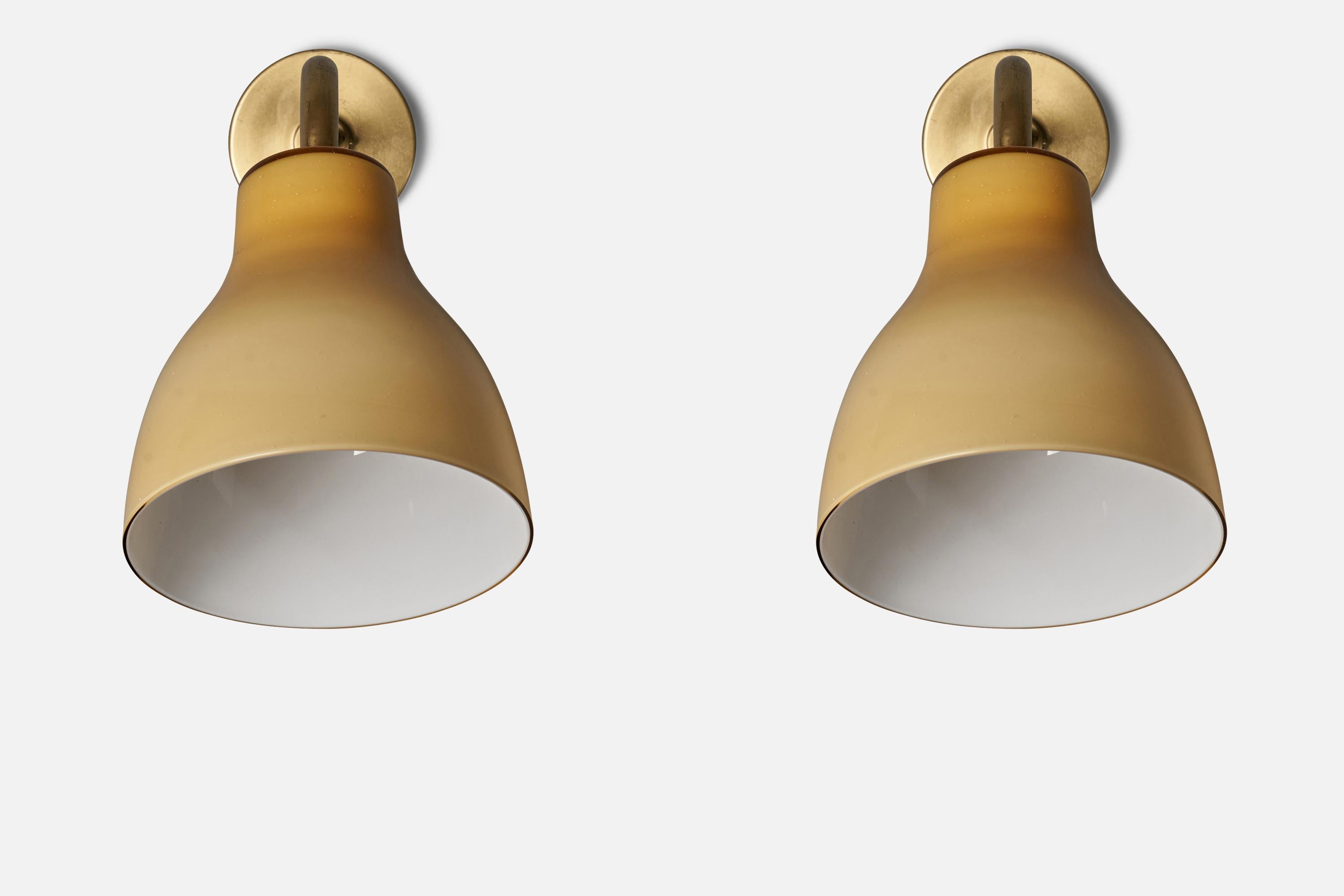 A pair of sizable wall lights. Produced by Bertil Brisborg, for Nordiska Kompaniet, 1940s. Features brass and original yellow glass.

Other designers of the period working in similar style include Hans Bergström, Paavo Tynell, Alvar Aalto, Serge