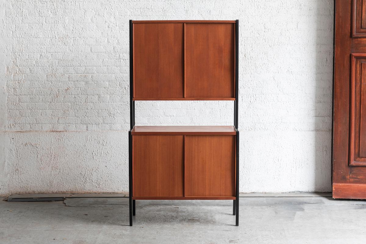 Freestanding wall unit system by Bertil Fridhagen for Bodafors, designed and produced in Sweden in the 1960s. Standing metal supports combined with teak wooden elements. The system features two sliding door cabinets. The inside of the top cabinet
