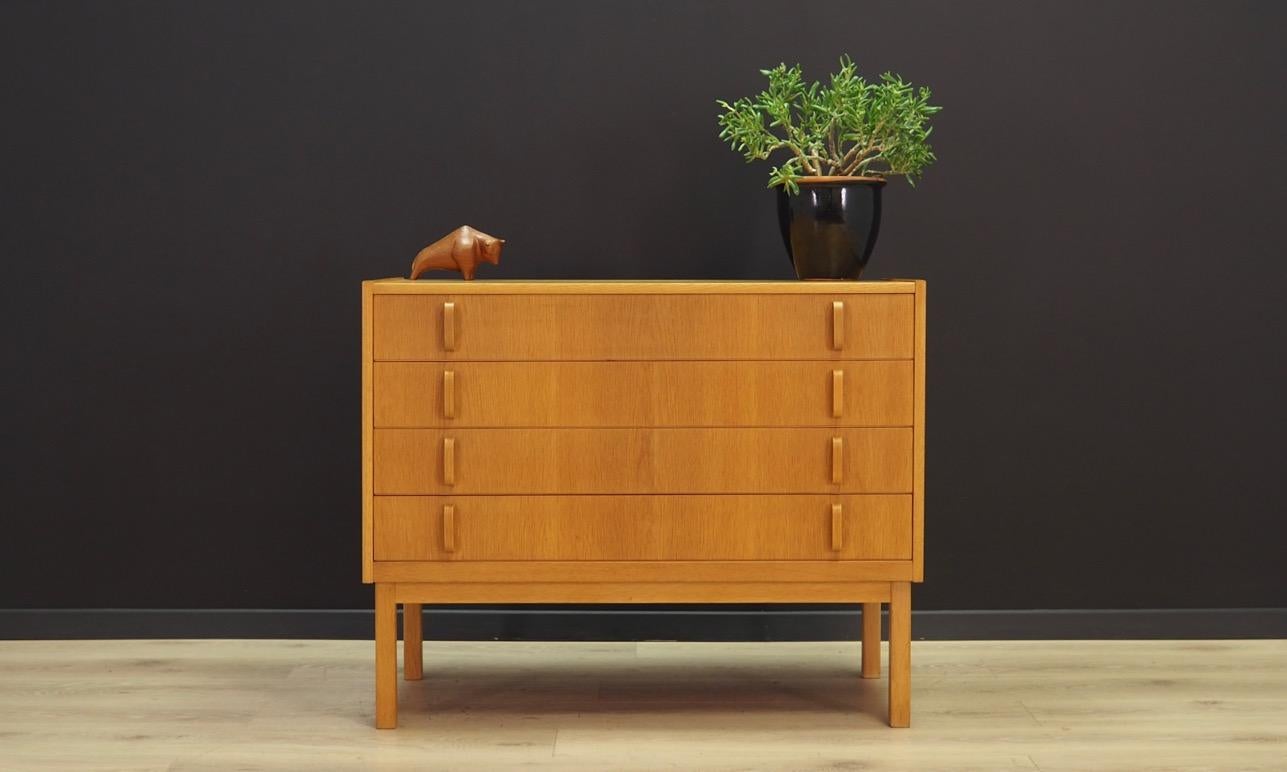 Fantastic chest of drawers from the 1960s-1970s, Scandinavian design, Minimalist form. Furniture designed by Bertil Fridhagen, produced in Bodafors factory. Chest finished with ash veneer. Four packing drawers with original handles. Maintained in