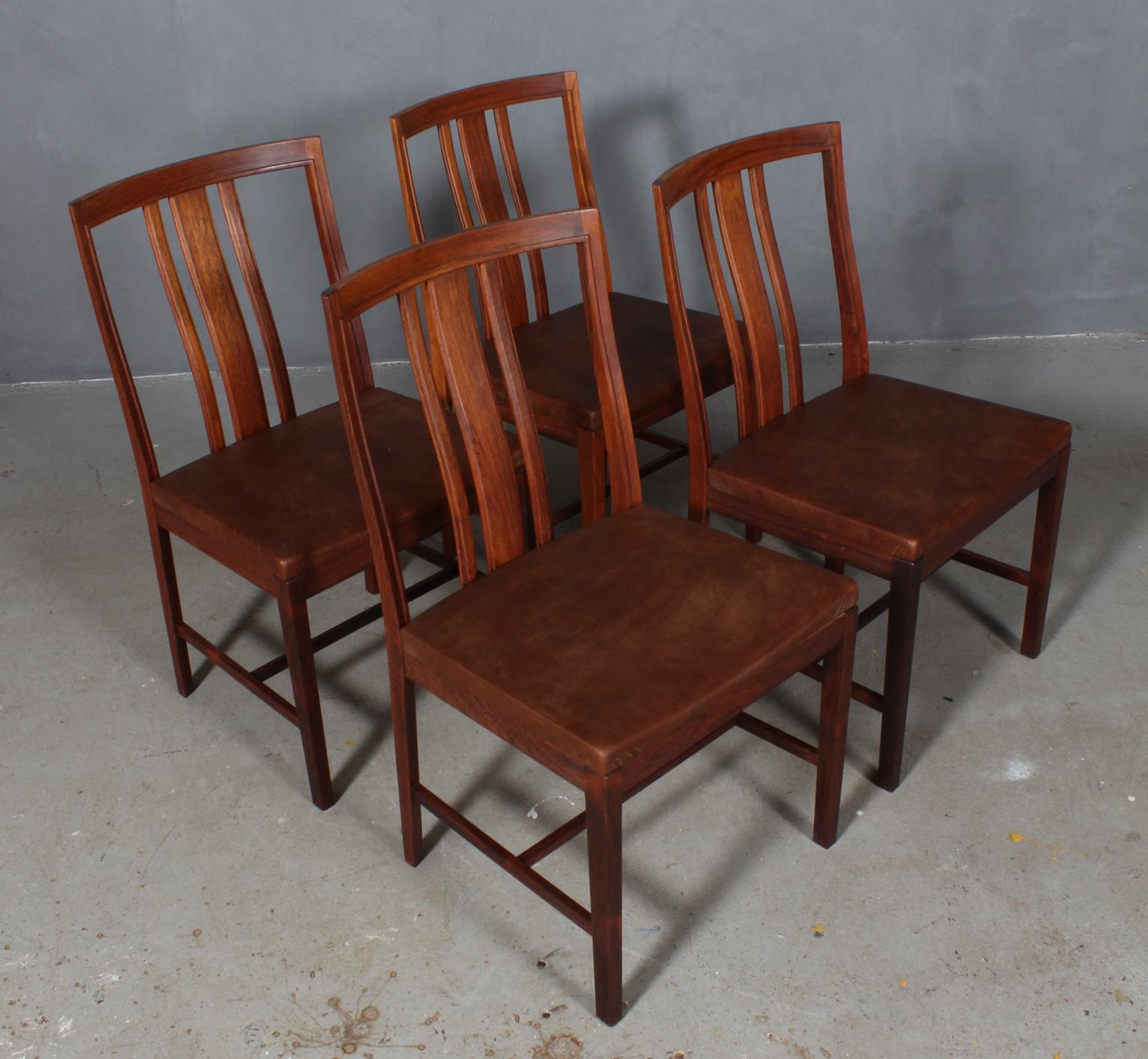 Bertil Fridhagen set of four dining chairs in rosewood.

New upholstered with brown vintage aniline leather. 

Made by Bodafors.