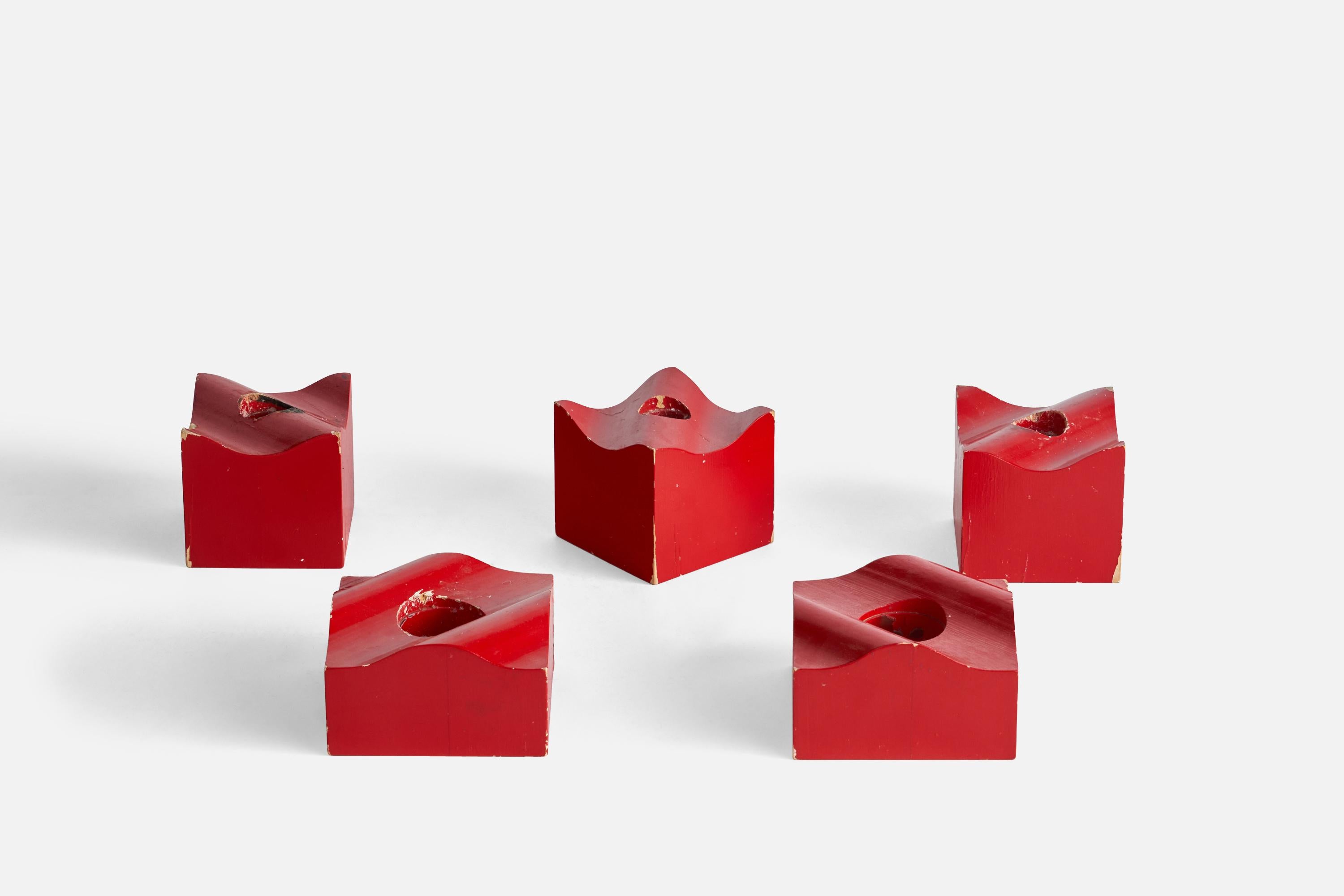 A set of five red-painted organic candlesticks designed by Bertil Valien and produced by Boda Trä, Sweden, c. 1960s.

Holds 1.4” diameter candles
smaller candle holders hold 0.7” diameter candles
With losses to red paint.