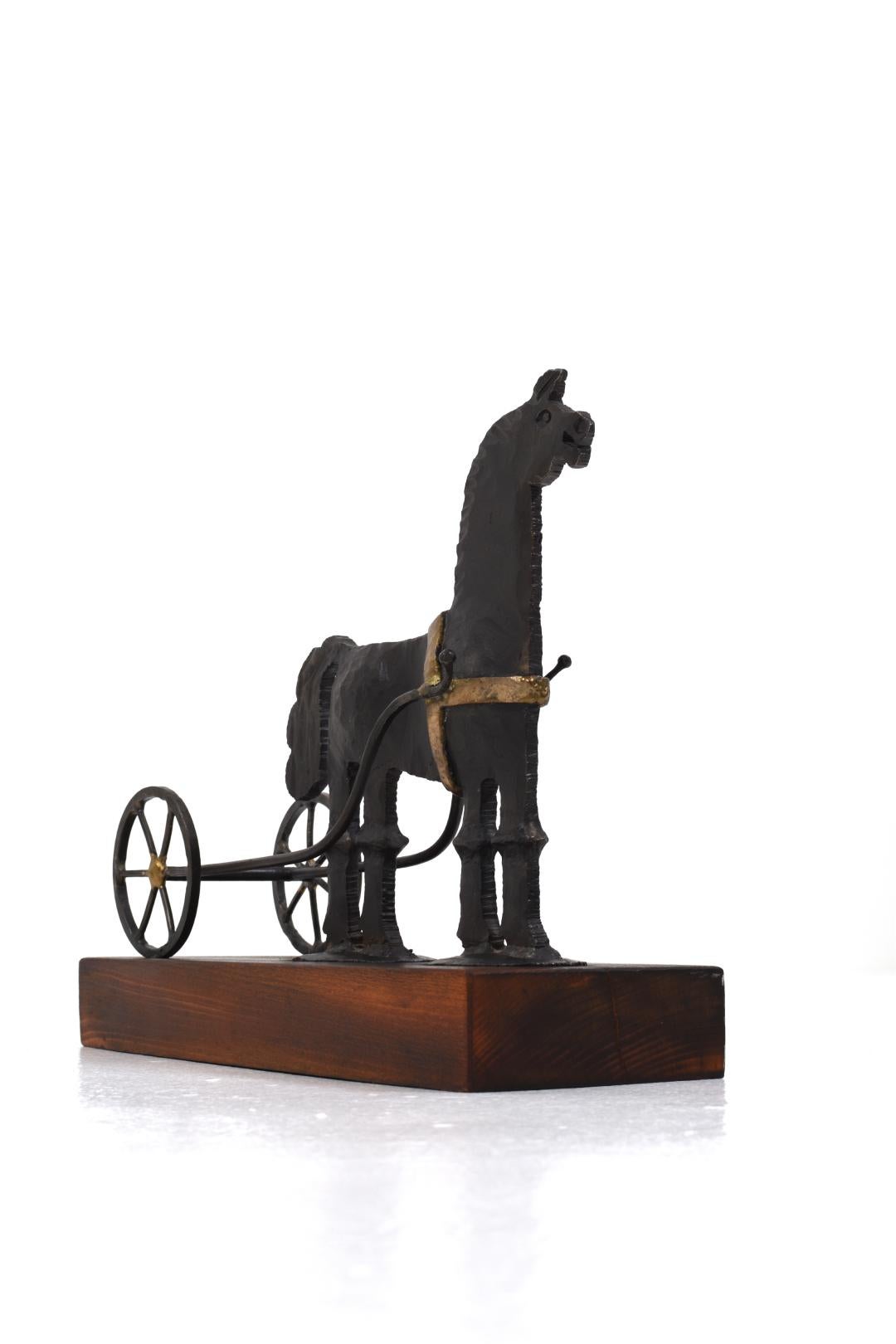 Bertil Vallien and Horst Graf, sculpture, wrought iron in the form of a horse with a cart for Boda Forge.

Bertil Vallien is a Swedish glass artist born in 1938 in Sollentuna. He is known for his sculptural glass objects and sculptures that are