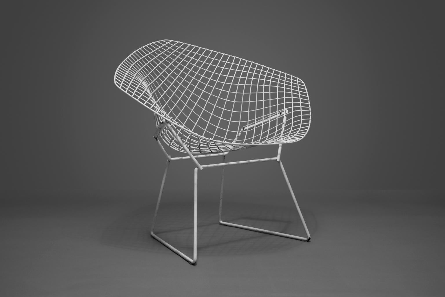 SALE ONE WEEK ONLY

Bertoia Diamond Chairs, White, Set of Two, Welded & Painted Steel. They are as elegant, strong and functional as when they were manufactured. The chairs will add a touch of class to any setting.

Harry Bertoia's career began in