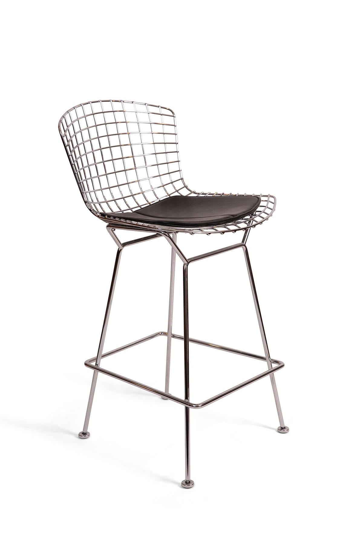 Pair of Harry Bertoia for Knoll chrome barstools. These examples are American made within the past 20 years and are in excellent original condition. Price listed is for the pair with black seat pads.