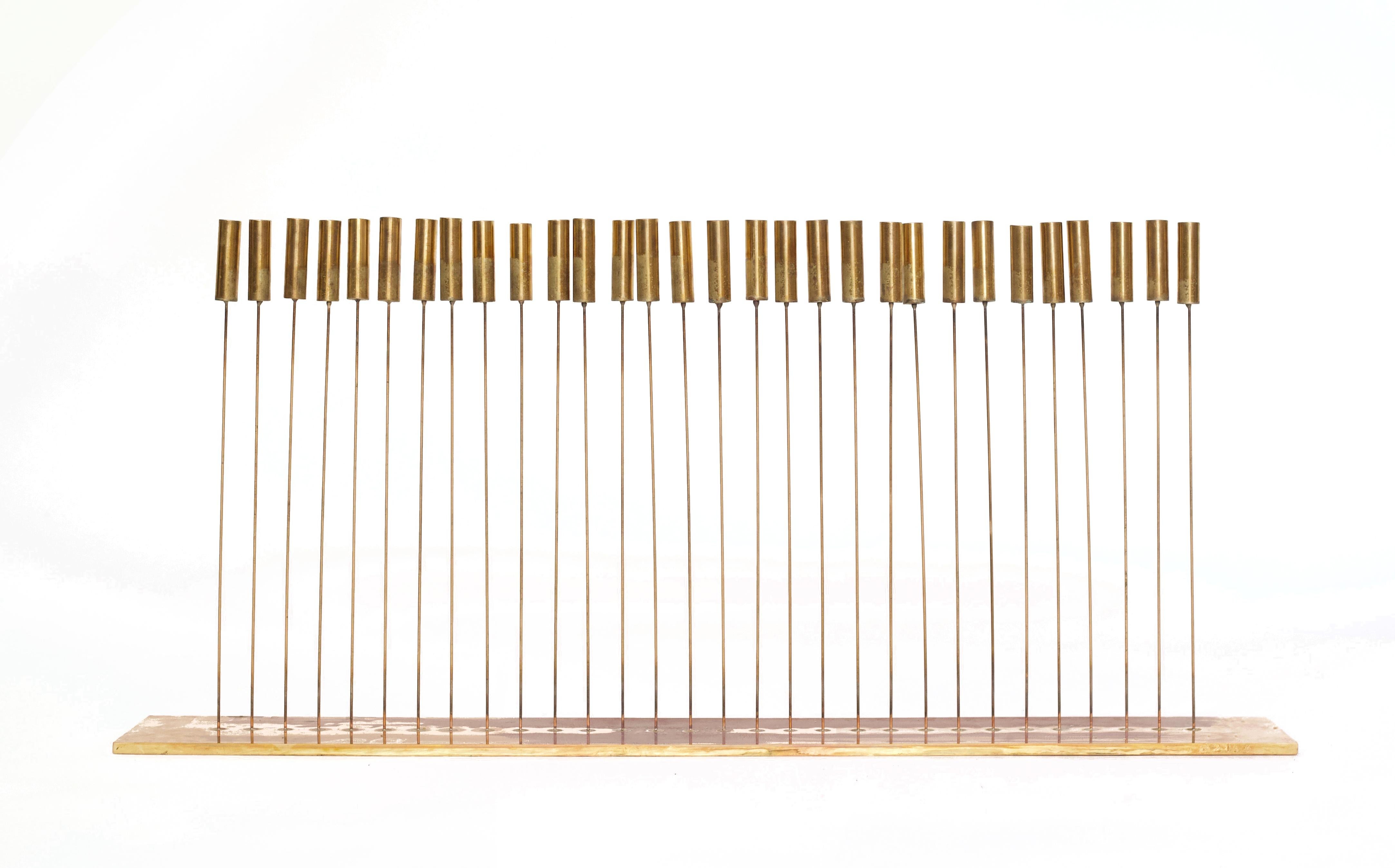 This authentic Bertoia Studio Sound Sculpture features 30 brass tops silvered to Harry Bertoia's Beryllium thin copper rods silvered to a brass bass. This piece was designed by Val Bertoia, the son of Harry Bertoia. Val Bertoia worked alongside