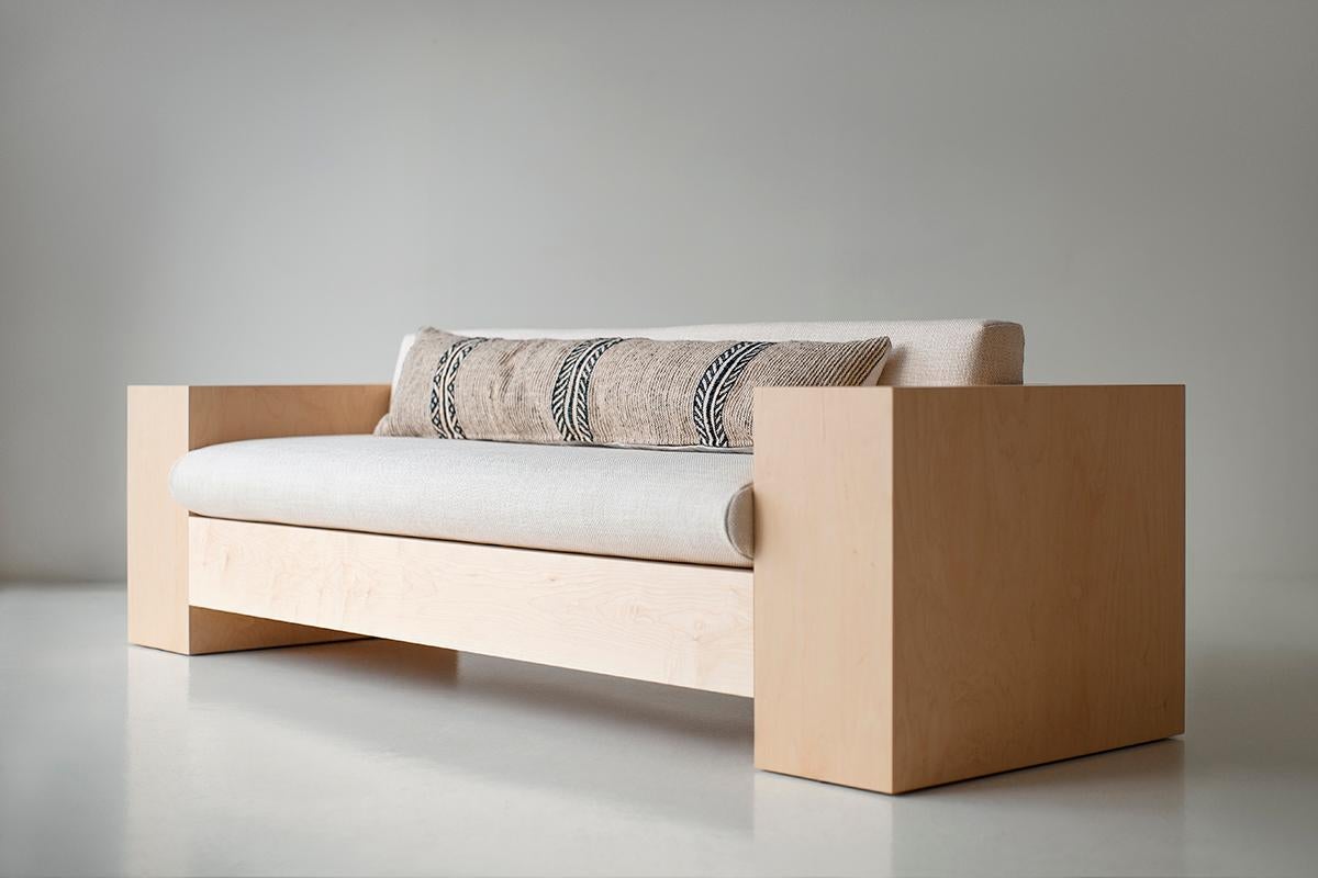 This Modern Maple Mondo Sofa is beautifully constructed from solid wood and veneer in Ohio, USA. The sofa's silhouette is low, simple, and modern with comfortable reversible back and seat cushions. I like to describe this collection as