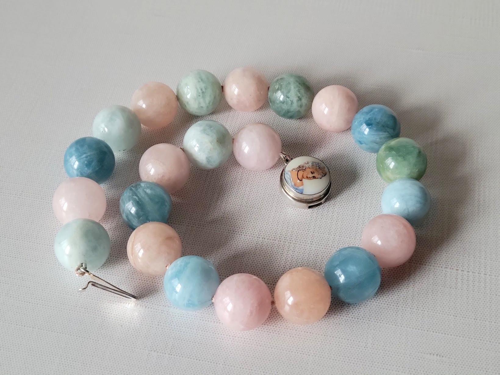 We present to you a romantic, delicate, and exquisite necklace. It measures 19 inches (48 cm) in length, featuring rare, massive, hand-cut pure beryl beads, each measuring 20 mm. The beads display a soft watercolor blend of green and blue with
