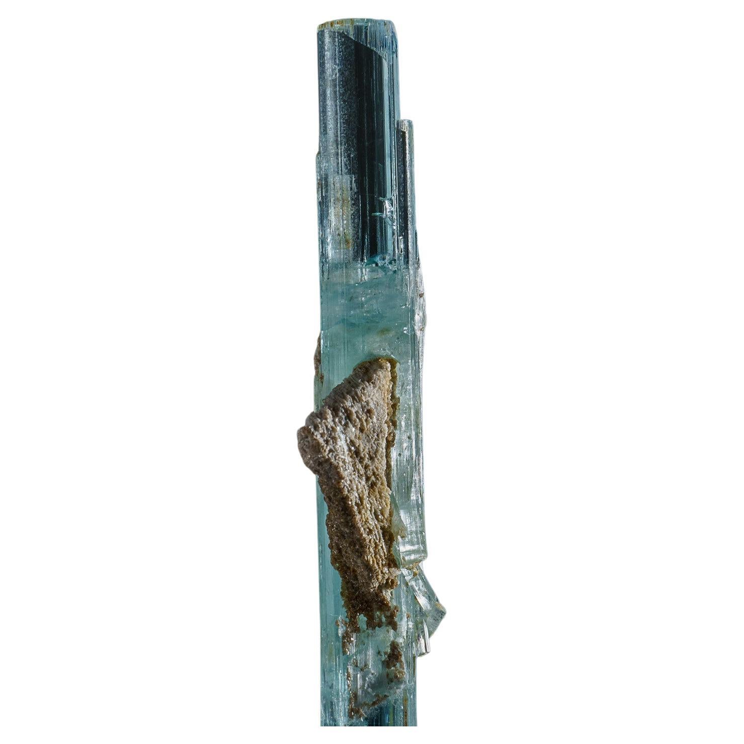 From Shigar Valley, Shigar District, Gilgit-Baltistan, Pakistan

Lustrous translucent to transparent gemmy crystals of aquamarine beryl with muscovite crystals around. The aquamarine crystal is highly transparent with glassy crystal faces.