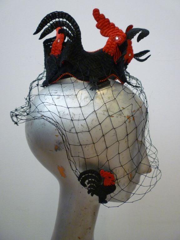 The Bes-Ben company of Chicago were known for their outrageous hats and boasted celebrities, socialites and artists as their clients.  This hat was no exception to the rule at Bes-Ben: Novelty is Everything!  A coronet of red and black embroidered