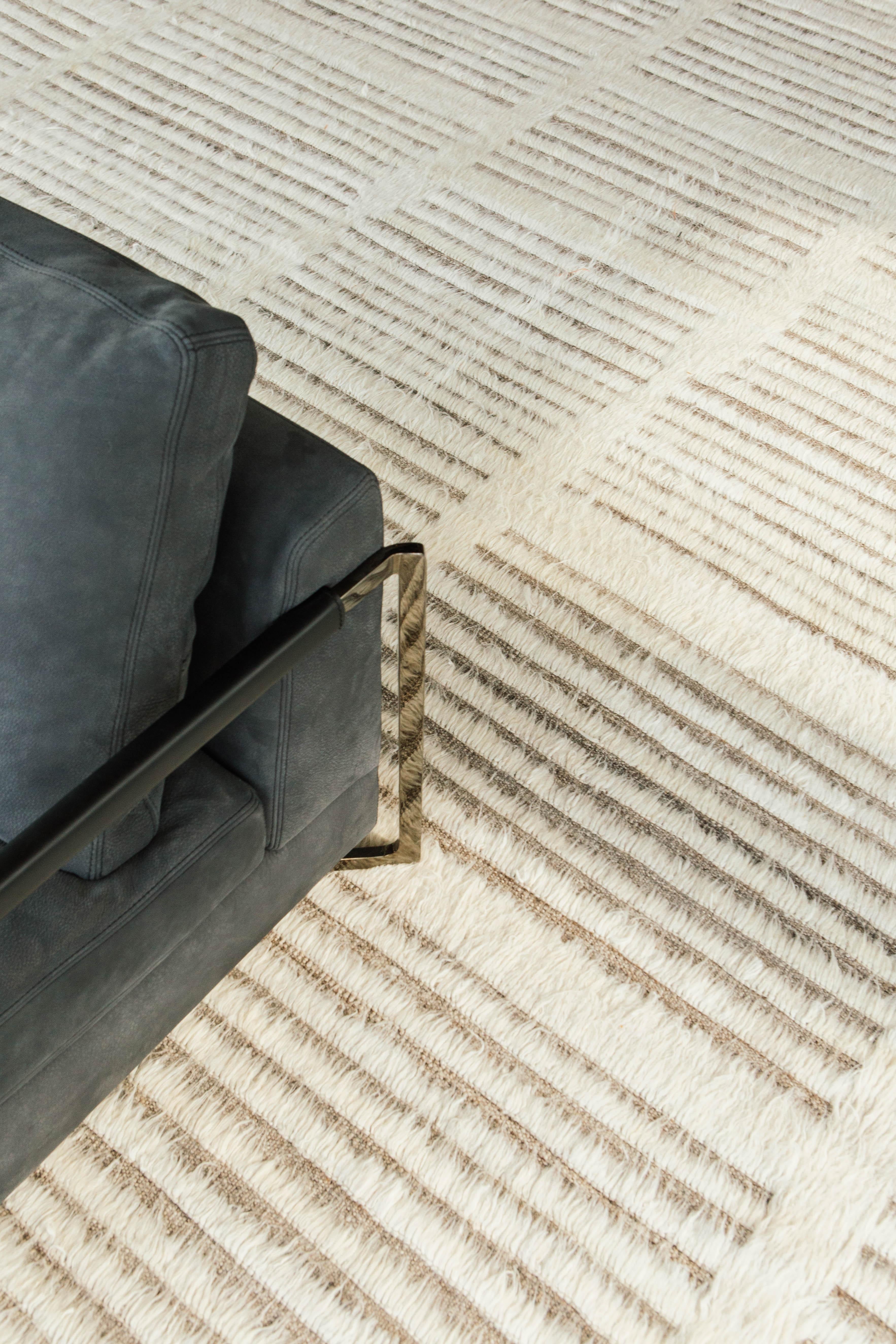 The signature Collection of California. Handwoven luxurious wool rug, made of timeless design elements and neutral earth tones with the perfect shade of white. Haute Bohemian Collection: designed in Los Angeles named for the winds knitting together