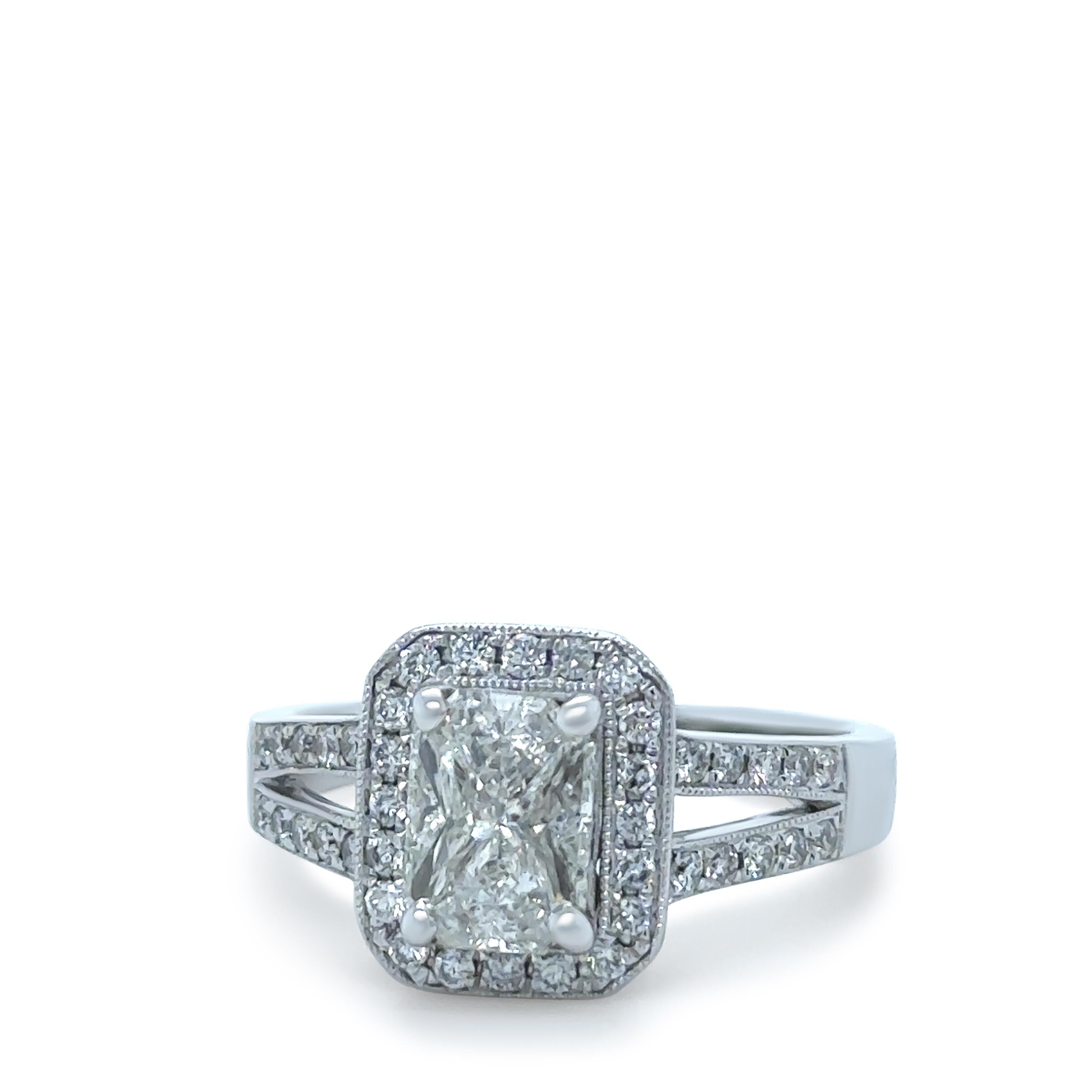 A Diamond Ring, made of 14ct White Gold. Centre section with a total of 4 Modified Kite Cut Diamonds, 2 weighing 0.30ct each, totalling 0.60ct. 2 weighing 0.24ct each, totalling 0.48ct.

40 Round Brilliant Cut Diamonds in pave setting, each weighing