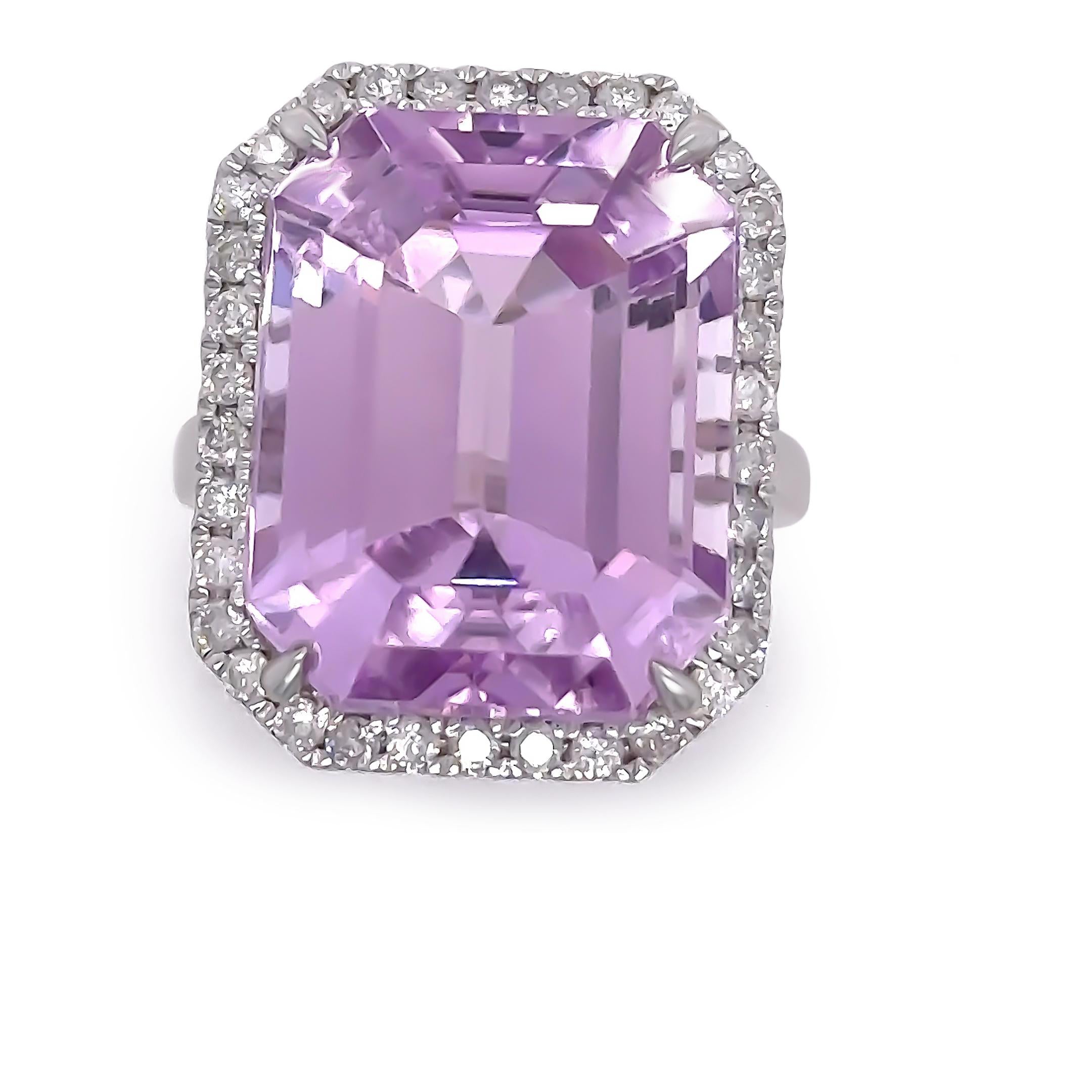 A Kunzite & Diamond Cocktail Ring, made of 14ct White Gold. Set with one Emerald Cut Kunzite, Purplish-Pink Colour, Very minor eye visible inclusions Clarity, weighing 25.92ct.

Additionally set with 34 Round Brilliant Cut Diamonds, J-K Colour,