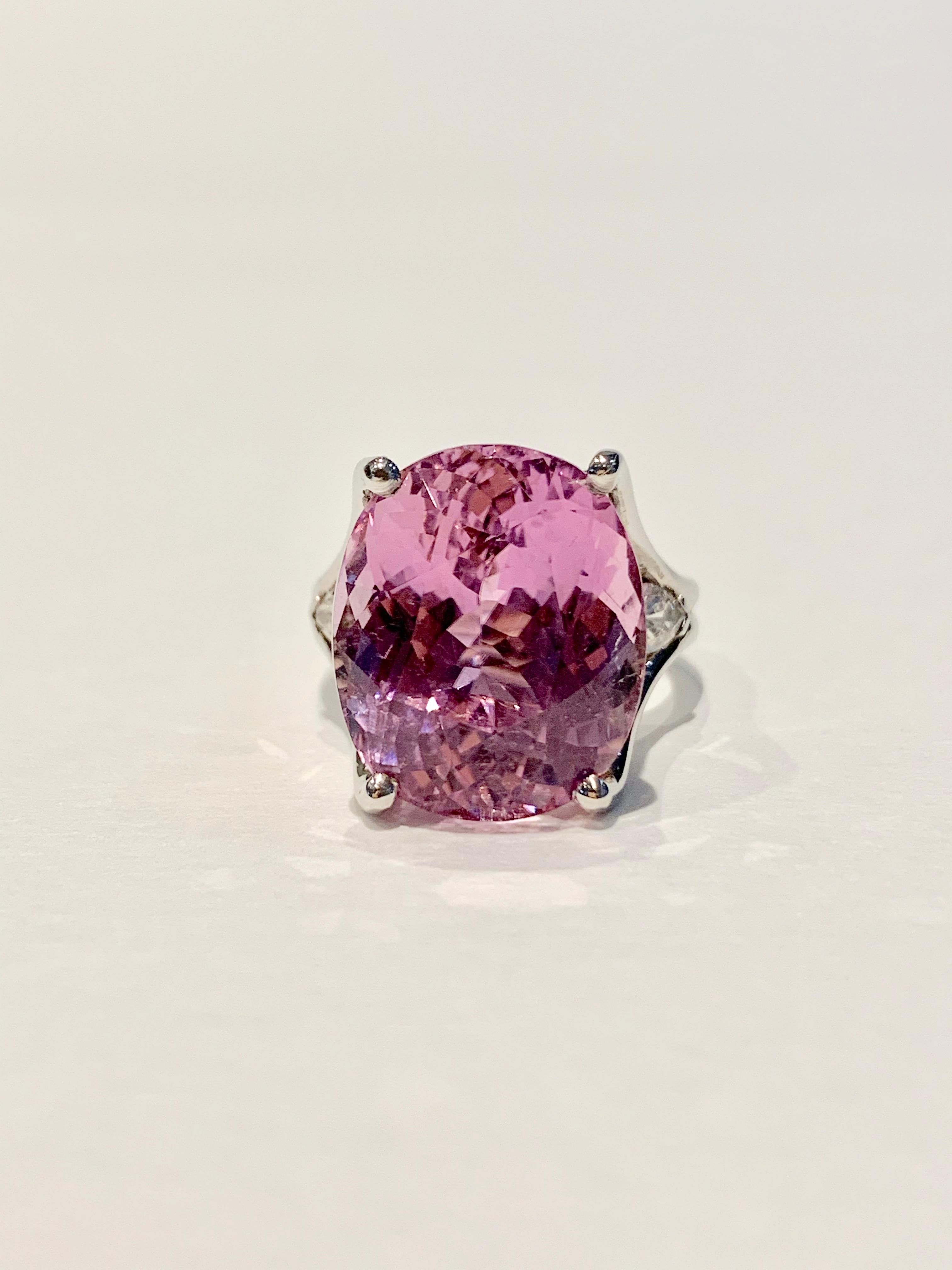 This BESPOKE designed Cocktail ring is set with an eye catching and incredibly feminine strong pink Kunzite* stone weighing 18cts and measuring 17 x 14 mm.  A CAD was used to get this modern double band design and to show off the Kunzite at its