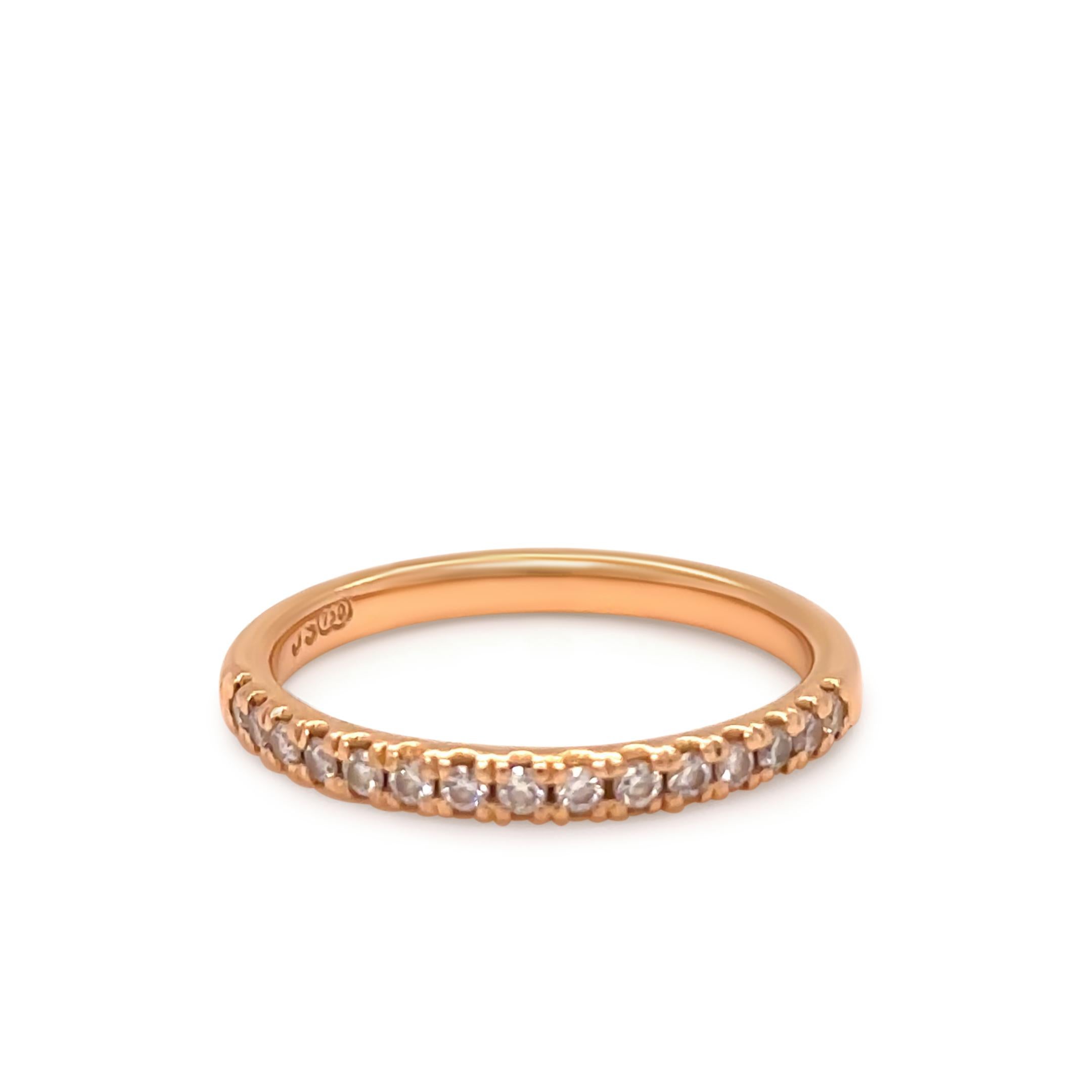 A Bespoke Diamond Wedding Band, made of 18ct Rose Gold. Set with 15 x 0.15ct Round Brilliant Cut Diamonds, each set in 4 claws on a A 1/2 Round band. 

Metal: 18ct Rose Gold
Carat: 0.225ct 
Colour: N/A
Clarity: N/A
Cut: Round Brilliant Cut
Weight: