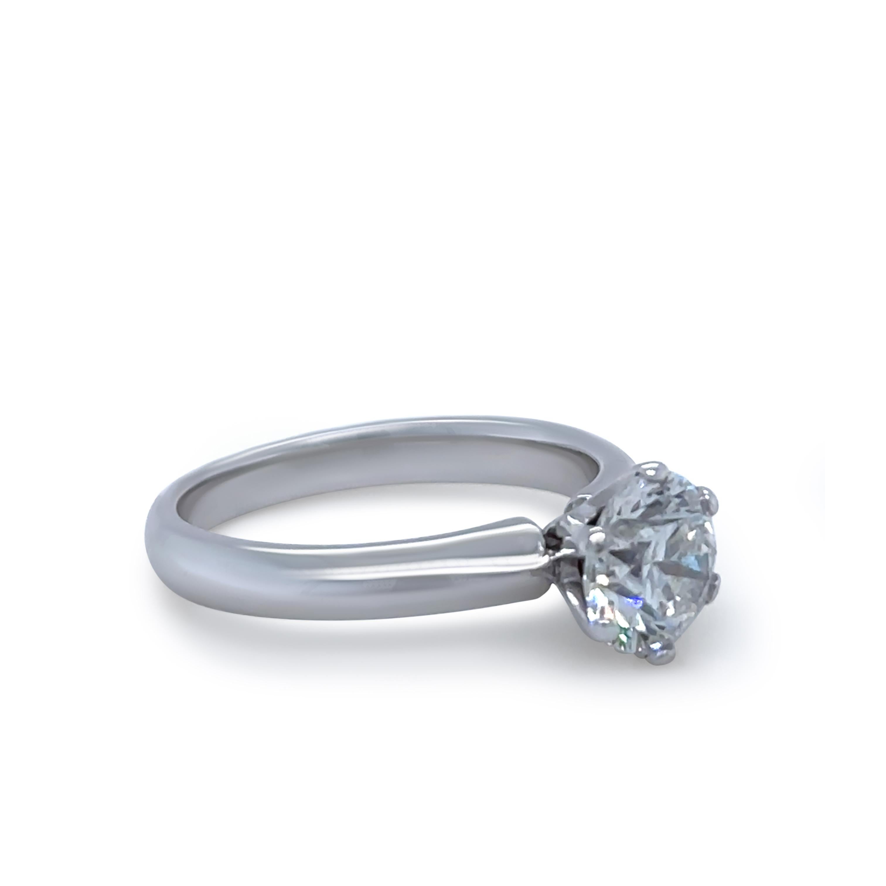 A handcrafted 18ct White Gold Diamond Engagement Ring, featuring a 1.26ct Round Brilliant Cut Diamond of F Colour and P1 Clarity. The diamond is set in a 6-claw Tiffany-style setting with a knife-edge band. Exclusively handmade by LeGassick.

Metal: