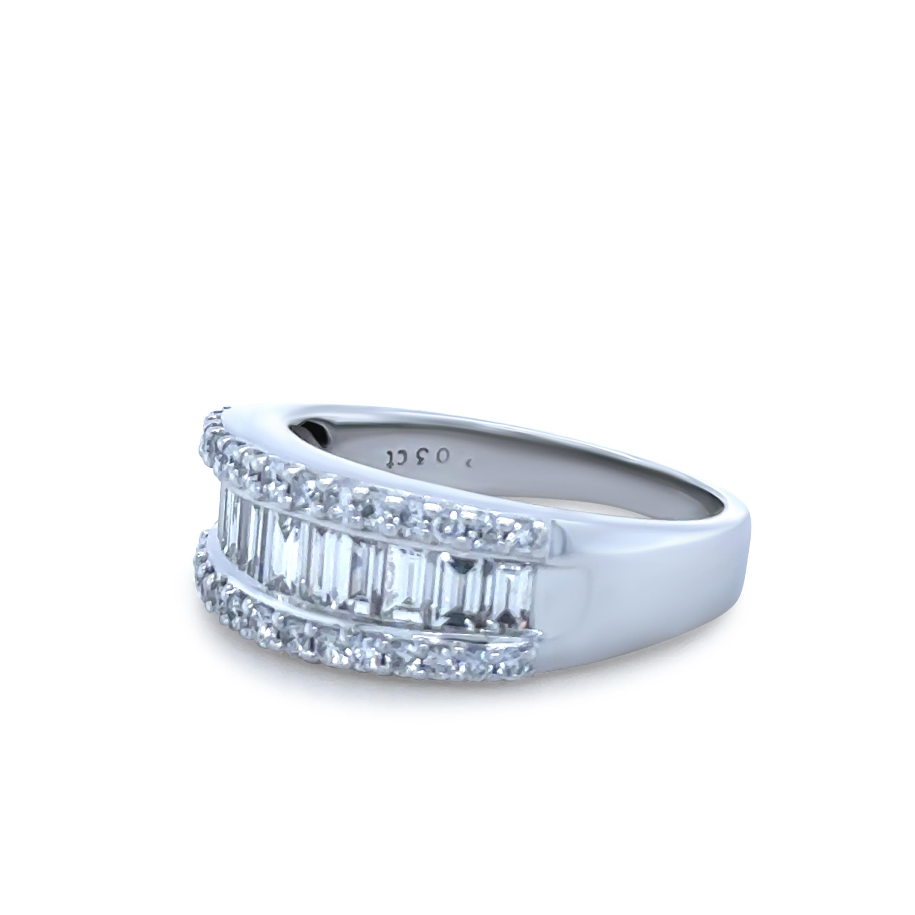A stunning 18ct White Gold Diamond Ring, featuring 11 baguette, step-cut Diamonds of F-G Colour and VS Clarity, complemented by 30 round, brilliant-cut Diamonds of F-G Colour and VS-SI Clarity, with a total diamond weight of 2.03ct.

Metal: 18ct