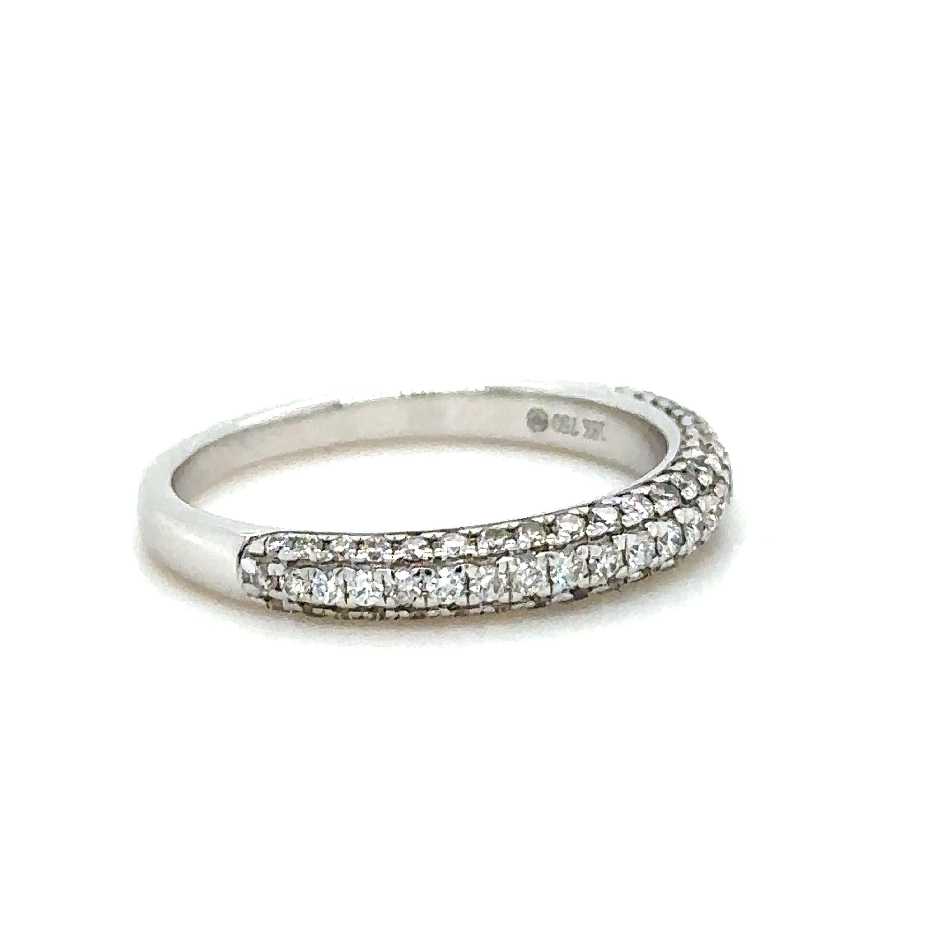 Unique features:

Diamond half eternity band. Made of 18 kt White Gold, in a pave setting, and weighing 2.8gm. Stamped: 18K 750.

Set with 67 round, brilliant cut Diamonds, colour F-G and clarity VS-SI. with a total weight of 0.44ct.

Metal: 18ct