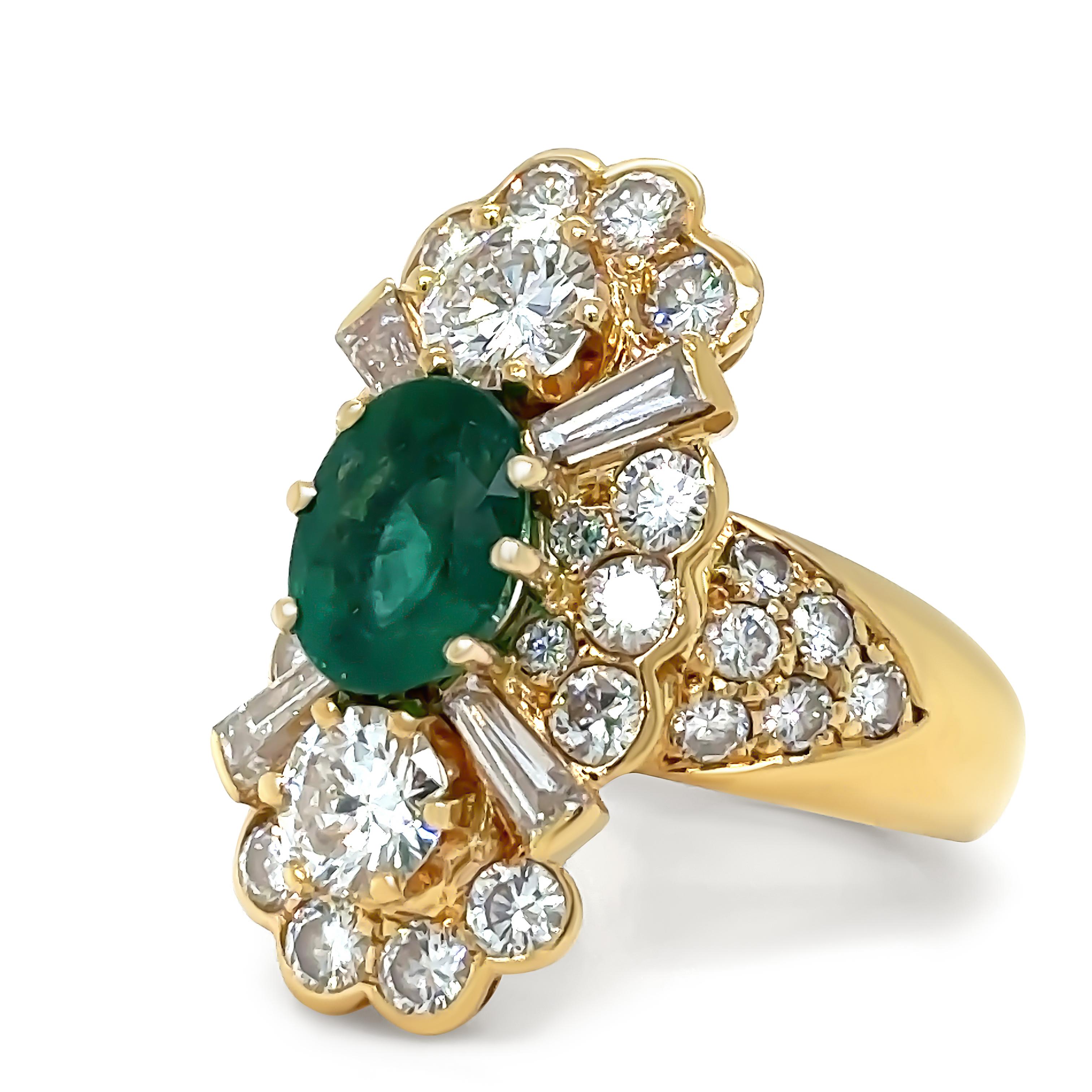 A Bespoke 18ct Yellow Gold (acid tested) 37 stone Emerald & Diamond cluster ring. Oval Emerald 6 claw set with 2 Round Brilliant Cut Diamond a 6 claw set & 4 tapered baguette Diamonds end cap set & 18 Round Brilliant Cut Diamonds grain set forming a