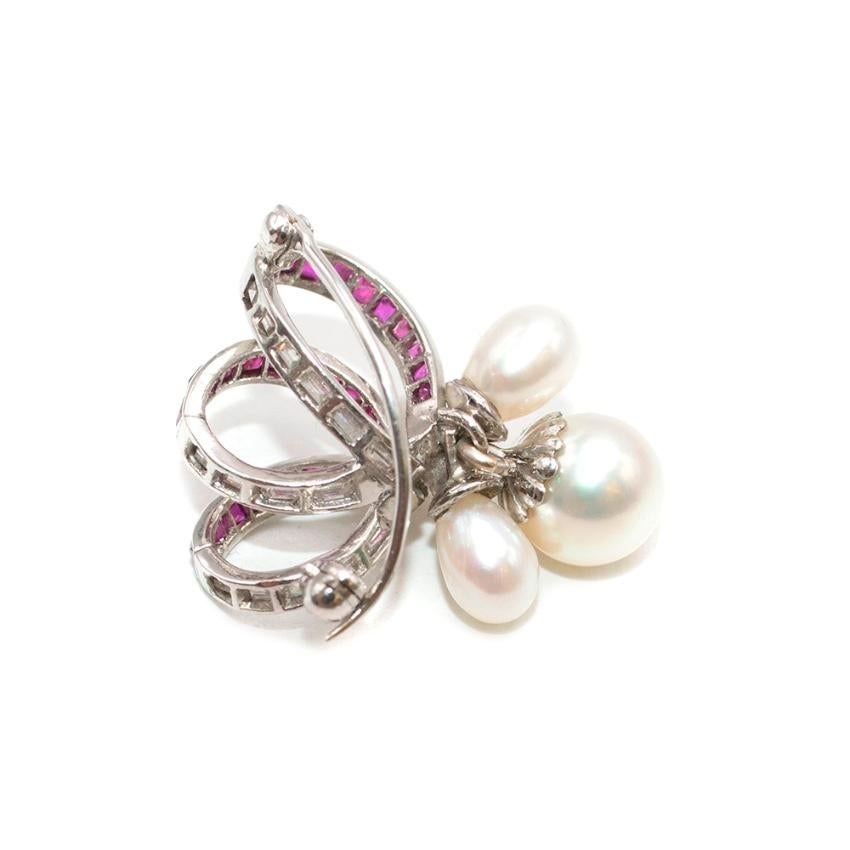 Bespoke 1940's White Gold, Freshwater Pearl, Ruby & Diamond Brooch

- Bespoke 1940's 
- Baguette Rubies & Diamonds in a channel setting
- Freshwater Pearls
- Pin and turn clasp fastening
- White gold 
- Appraised by Gray's

Please note, these items
