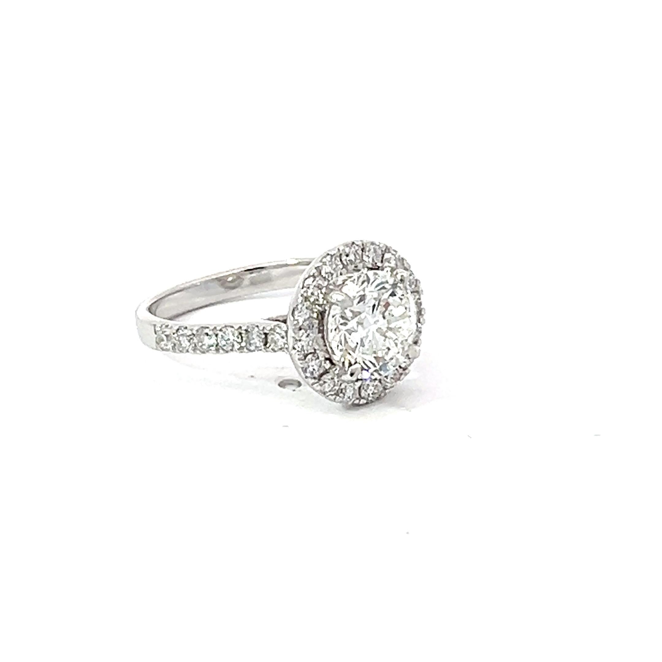 Introducing a stunning bespoke diamond engagement ring crafted with exquisite detail and artistry. This enchanting piece features a round brilliant cut natural diamond GIA certificated, set in lustrous 18 karat white gold, exuding timeless elegance