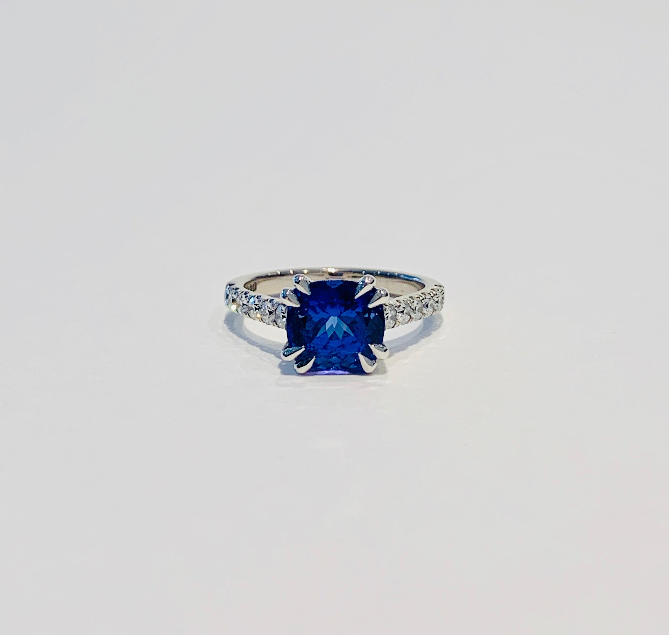 This premium stone is Tanzanite* at its best!  The velvety rich deep blue shows a little violet and has wonderful clarity.  A CAD was used to show this 7x 7 mm cushion cut Tanzanite at it best and the double claw setting gives it a very modern