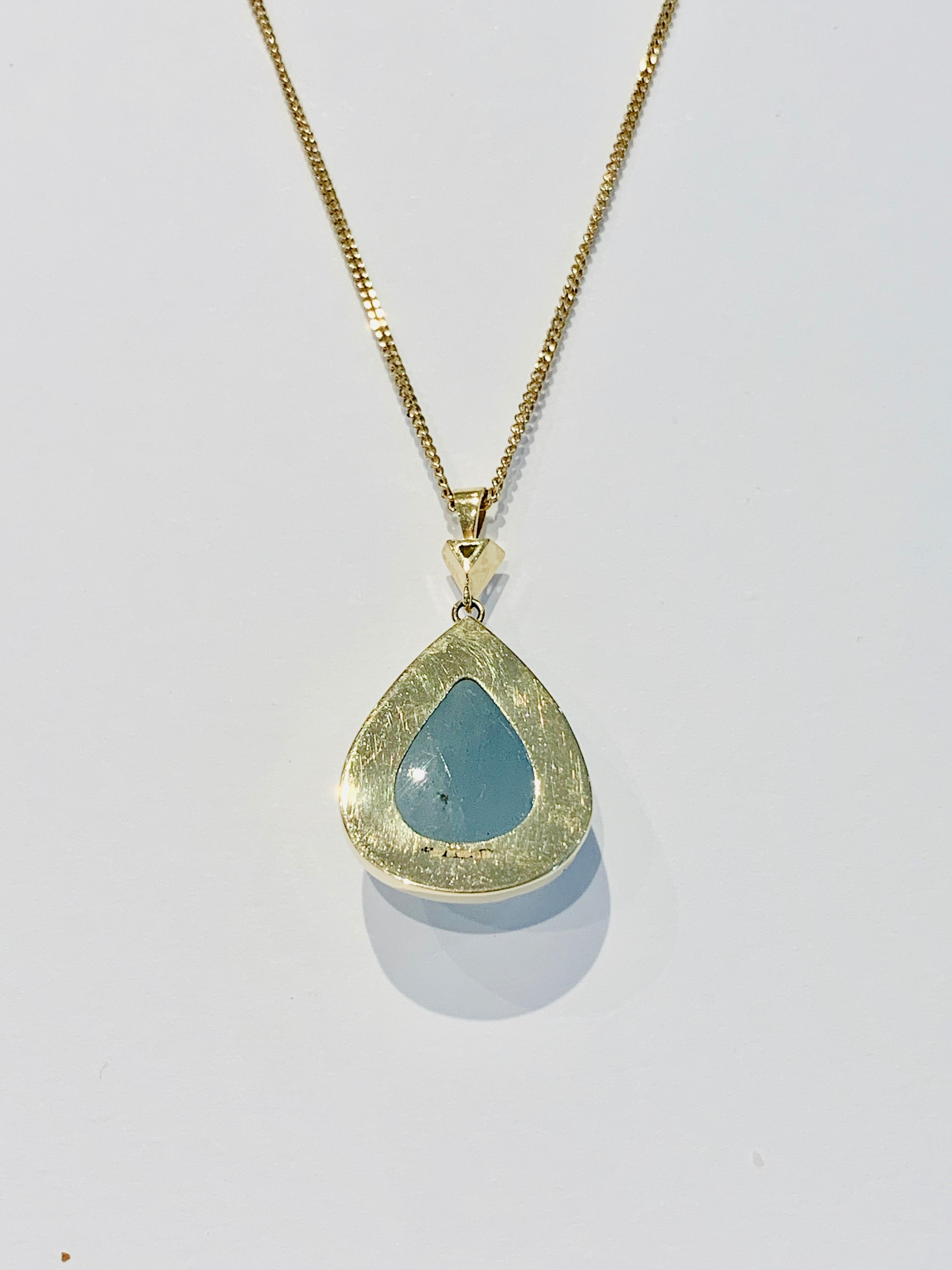 This unique BESPOKE Pear Cut Cabochon* Aquamarine* Pendant was designed using a CAD to make sure this large stone was shown off to its best,, also making this Pendant unique.  The design is of a bezel setting made of 18ct Yellow Gold and has a .20ct