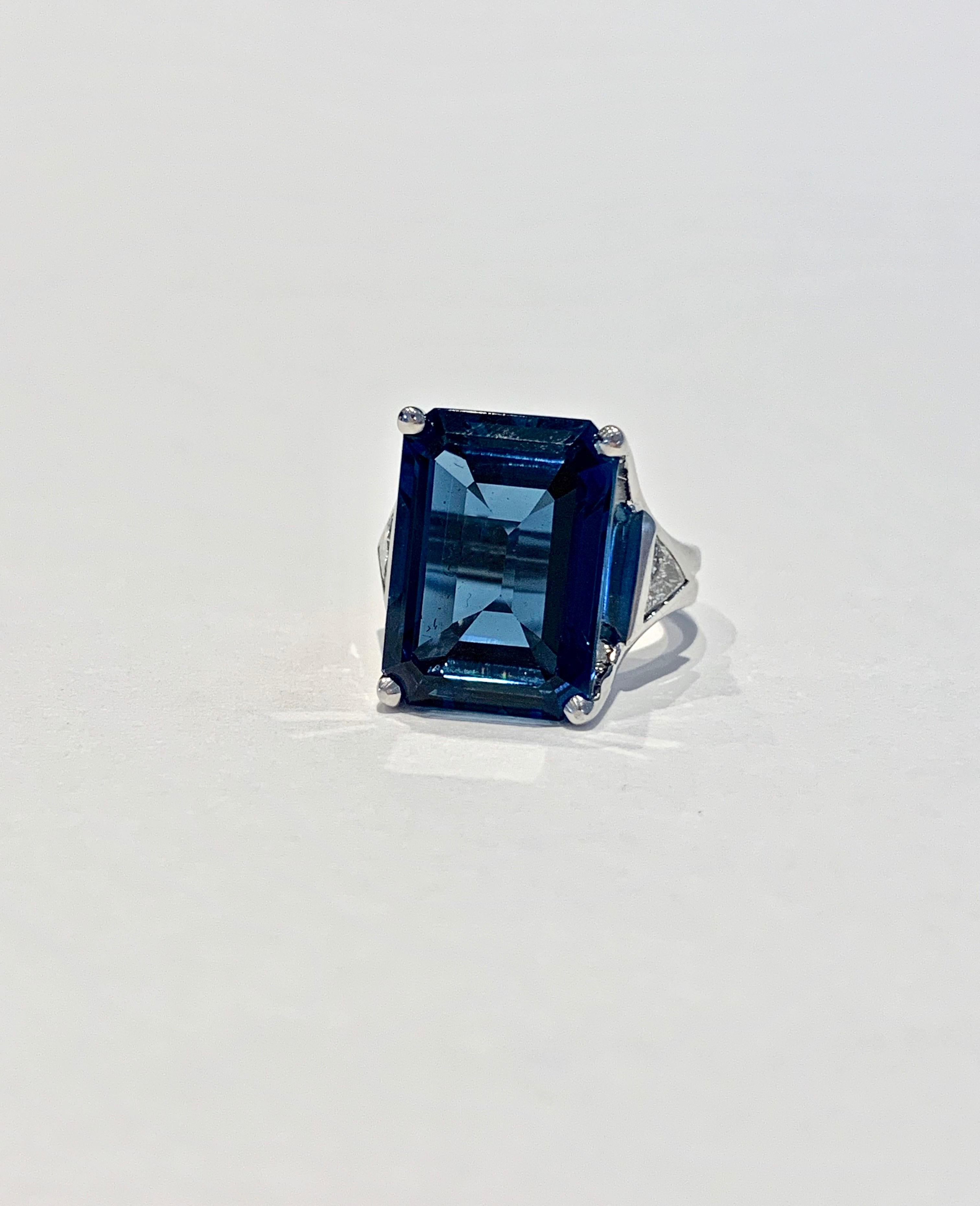 This stunning Bespoke ring is made of up a 7.20ct Octagon Cut Premium London Blue Topaz* which has a beautiful velvety dark blue colour and wonderful clarity.    A CAD was used to get this modern double band design and to show off the Topaz at its