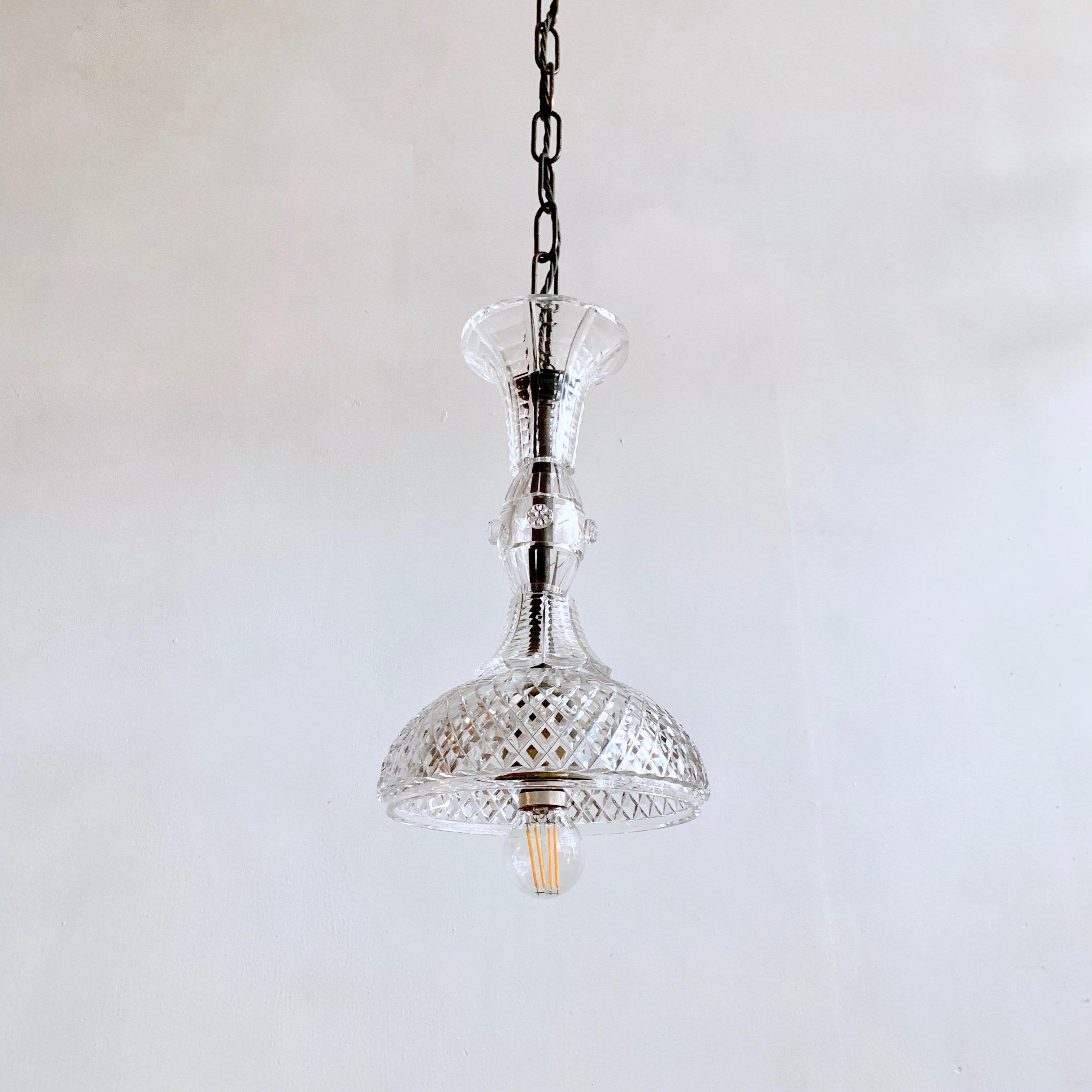 This pendant has been made with stacked antique English crystal chandelier parts, mostly ones that would usually go on the central stem of a chandelier. Each pendant is bespoke. The pendant requires a single B22 lamp. The pendant comes supplied with