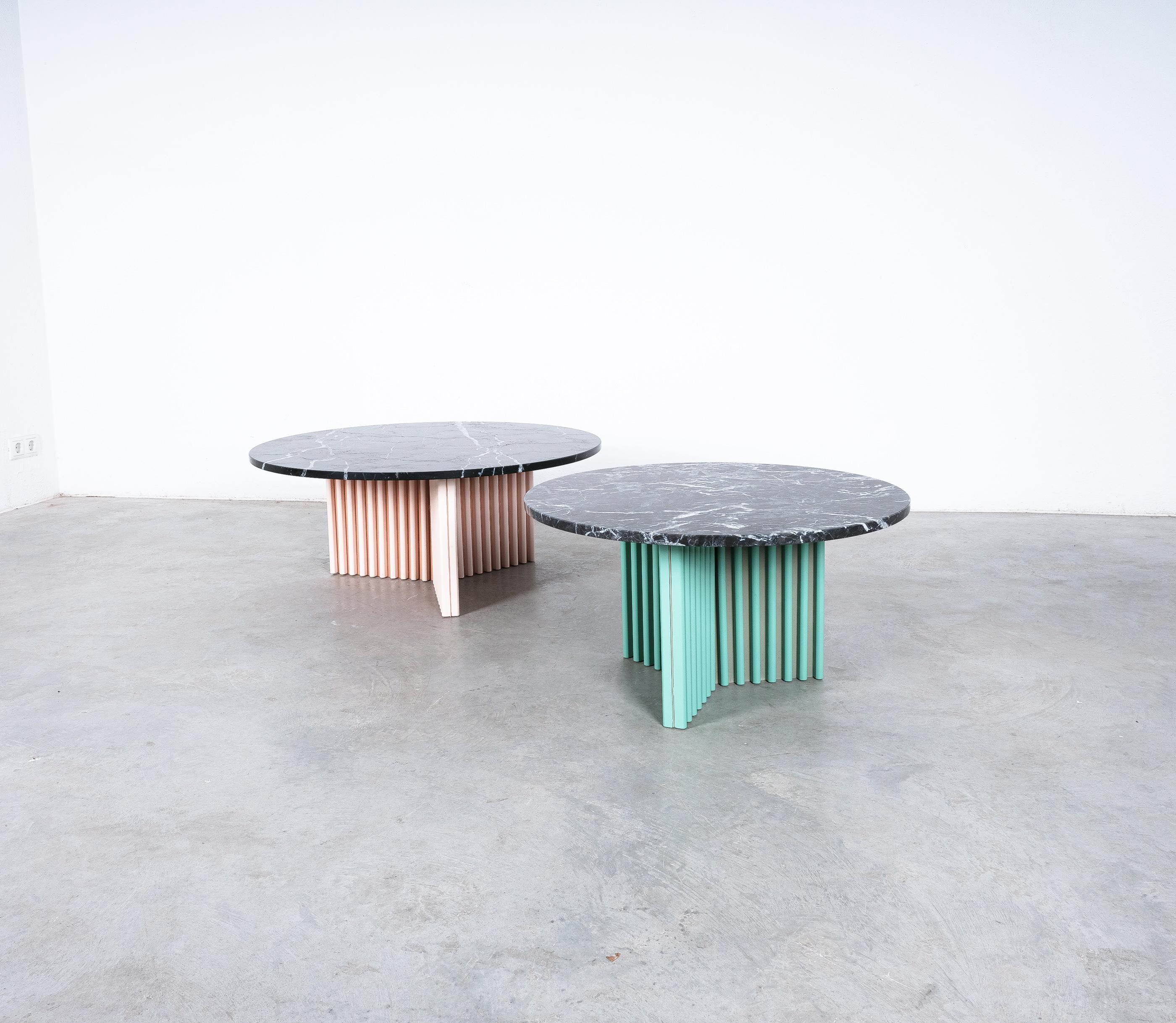 Post-Design pair of tables, bespoke marble tables (2), late 1980's, early 1990's

Sold and priced as a pair.

Pair of unique tables made from round marble tops on triangular shaped colored bases.
The bases are customized, made from stretched