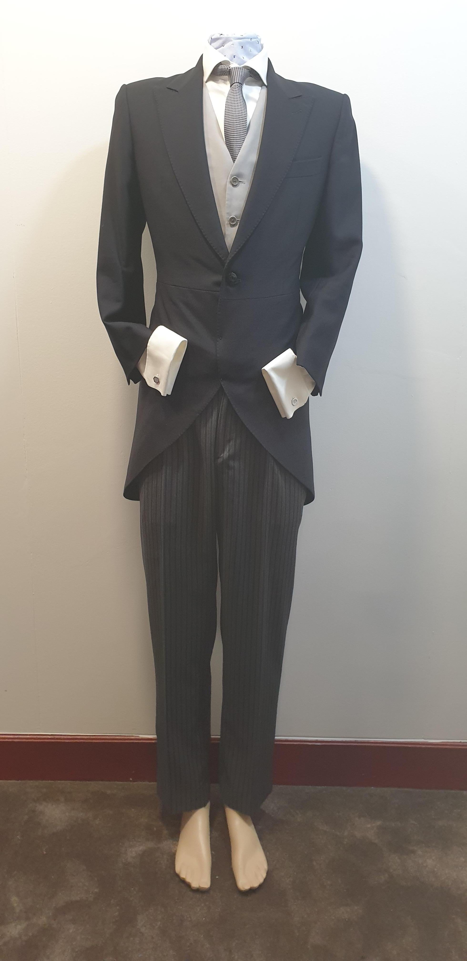 Bespoke black wedding morning suit  by Derby Bilbao
Consisting on long chaqué jacket, vest, cuff link blouse, tie, suspenders  and trousers 
Perfect Condition Only used Once 
Size 14 US
48 Spain
READY TO SHIP
*Shipment of this piece is not affected