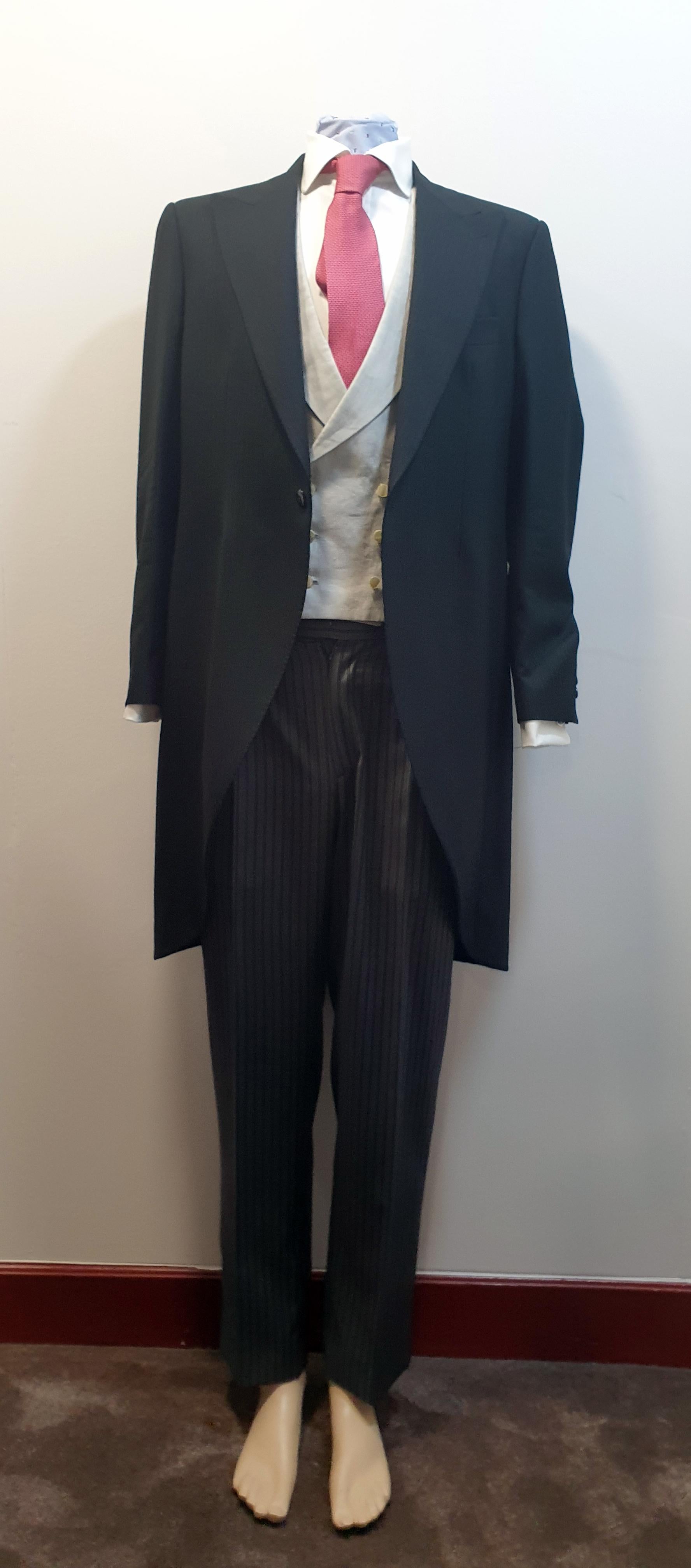 Bespoke black wedding morning suit by MAN Bilbao
Consisting on long tail chaqué jacket, vest, cuff link blouse, red tie, suspenders  and trousers 
Perfect Condition Only used Once Size 54 Spain

MAN 1924 appears once more in the publication Mr