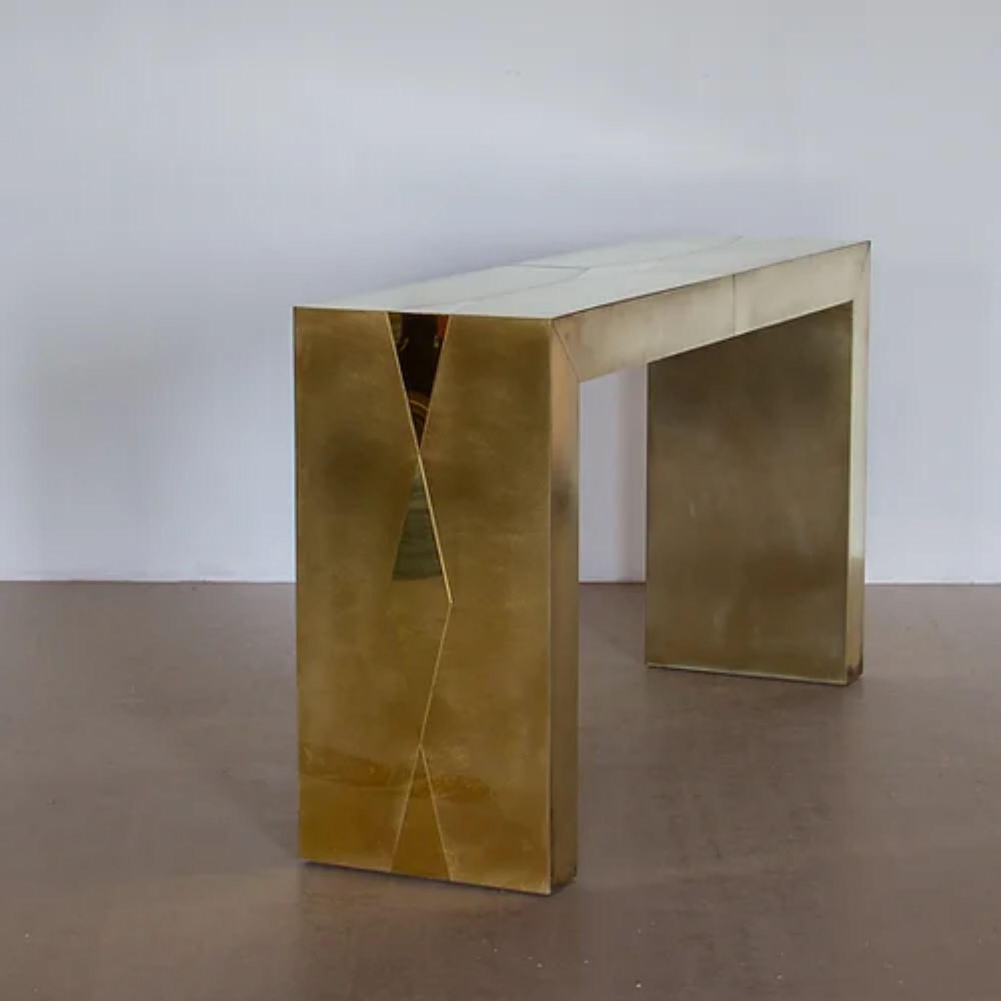 A bespoke matt brass console with polished brass diamond inlays, created by Ken Bolan Studio.

Additional Information:
Material: Brass