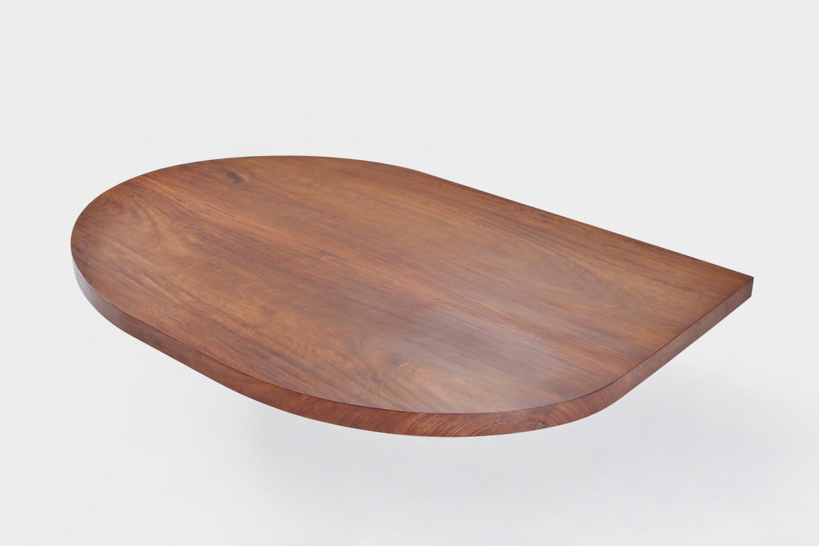 This is a truly bespoke table we just created for a Bangkok based client.
She asked us to design a table which would perfectly complement a rounded sofa.
She selected two slabs of antique Chicken-wing wood (jichi mu) from our collection.
We