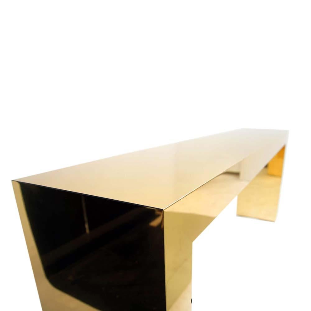 A stunning bespoke gold color brass console table by Railis Kotlevs contemporary design Iceland used only in a movie set.
These beautiful console have an Art Deco shape and fleur. The very elegant forms and perfect proportions of the design