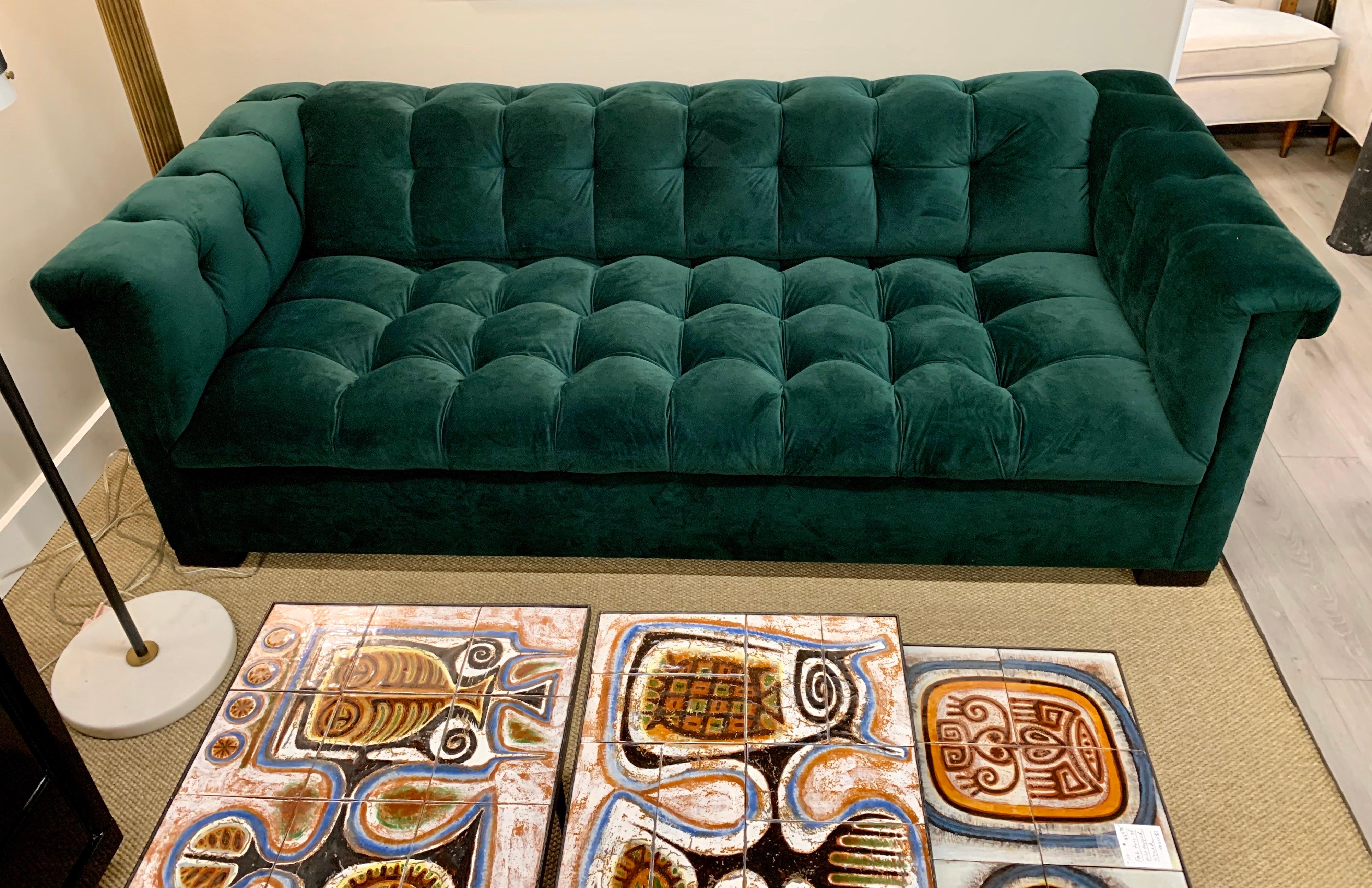 green velvet tufted sofa