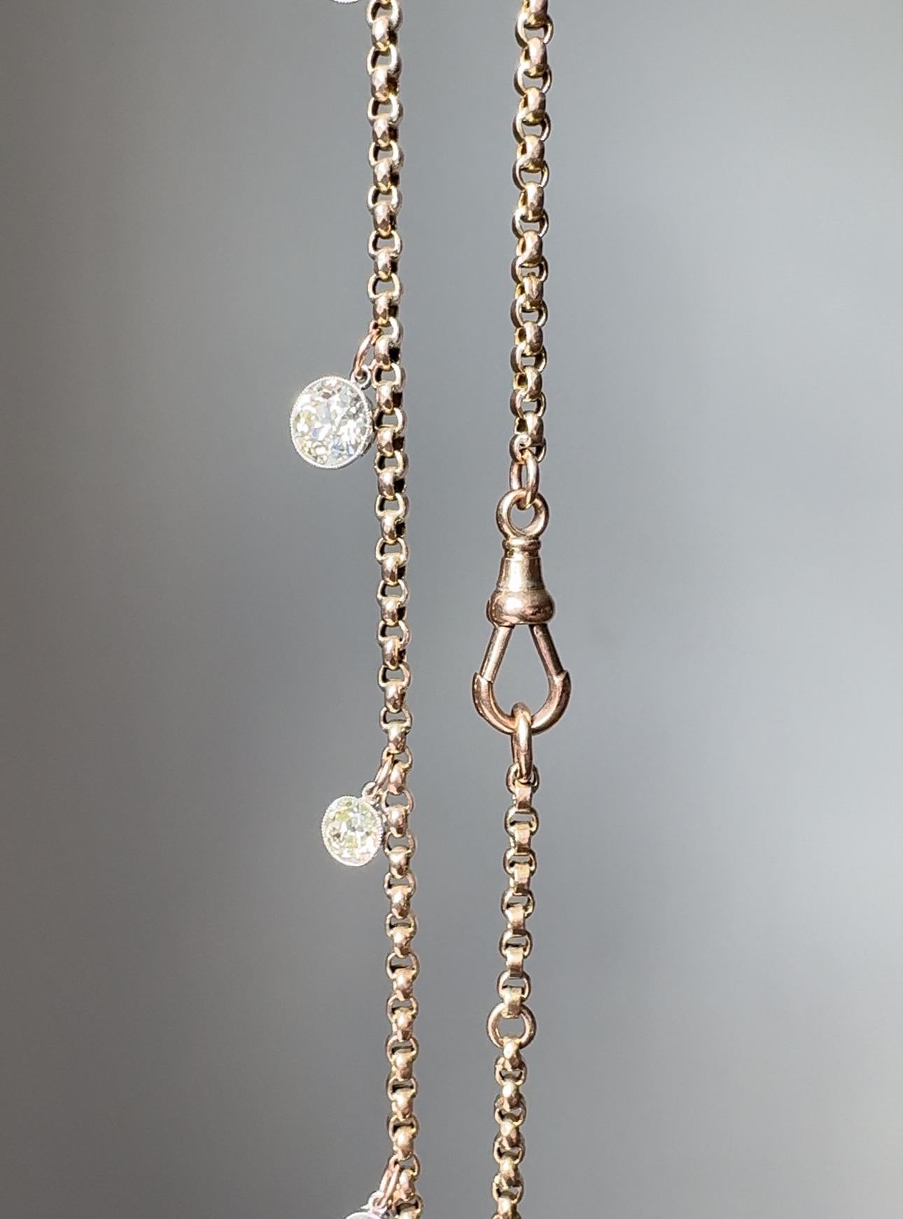 Wonderfully wearable, this bespoke necklace is composed of a graduated line of sparkling European cut diamonds, weighing a total of 4.37 carats, bezel set in platinum and suspended on a Victorian 9 karat rose gold belcher link chain. The necklace is